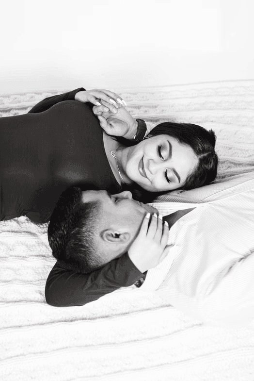 happy couple portrait photography laying down in the photo studio