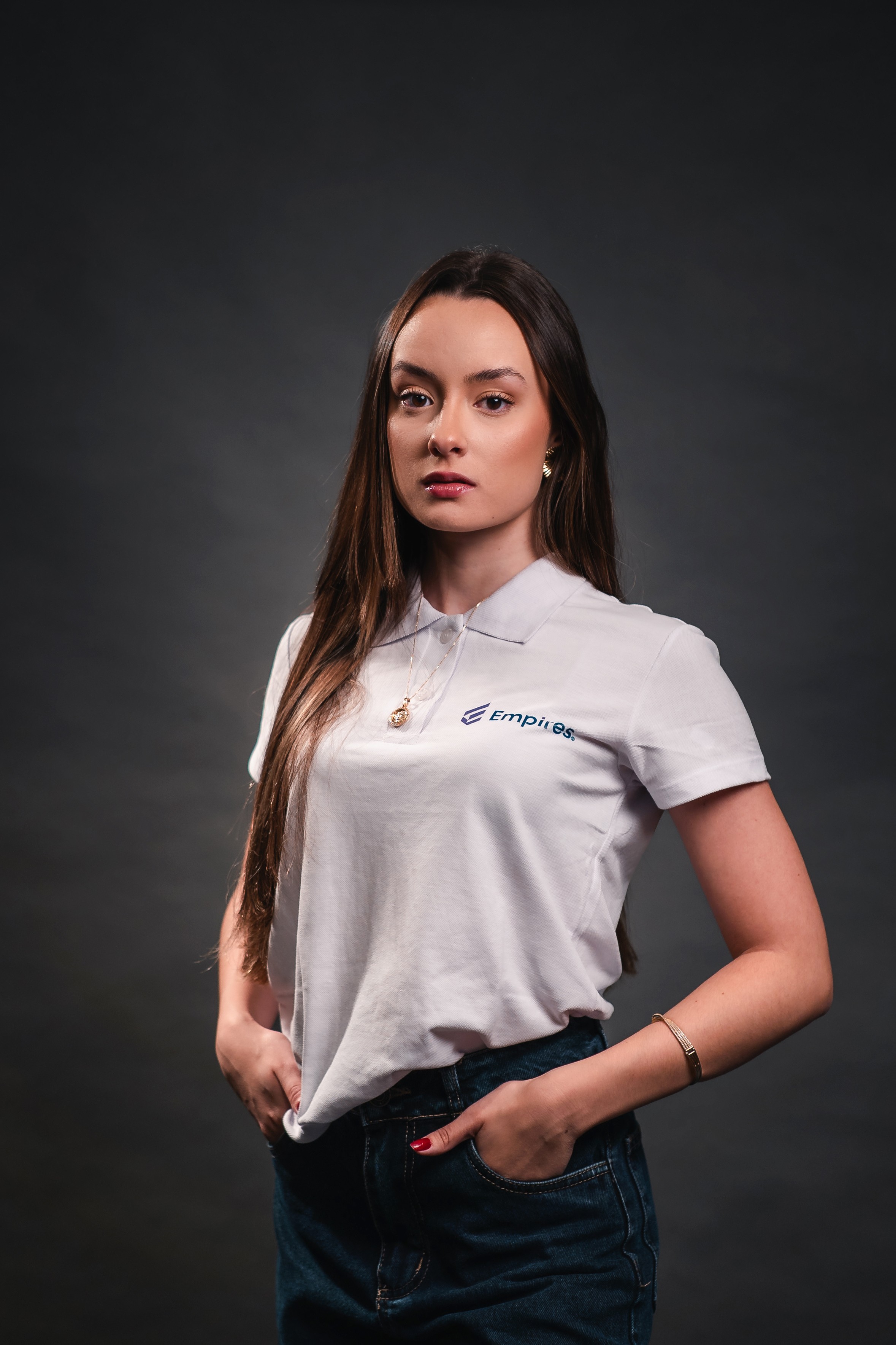 woman in black crew neck t-shirt wearing brown framed eyeglasses standing on rocky shore during