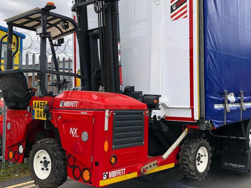 Imgae of a moffett attached to the back of a trailer