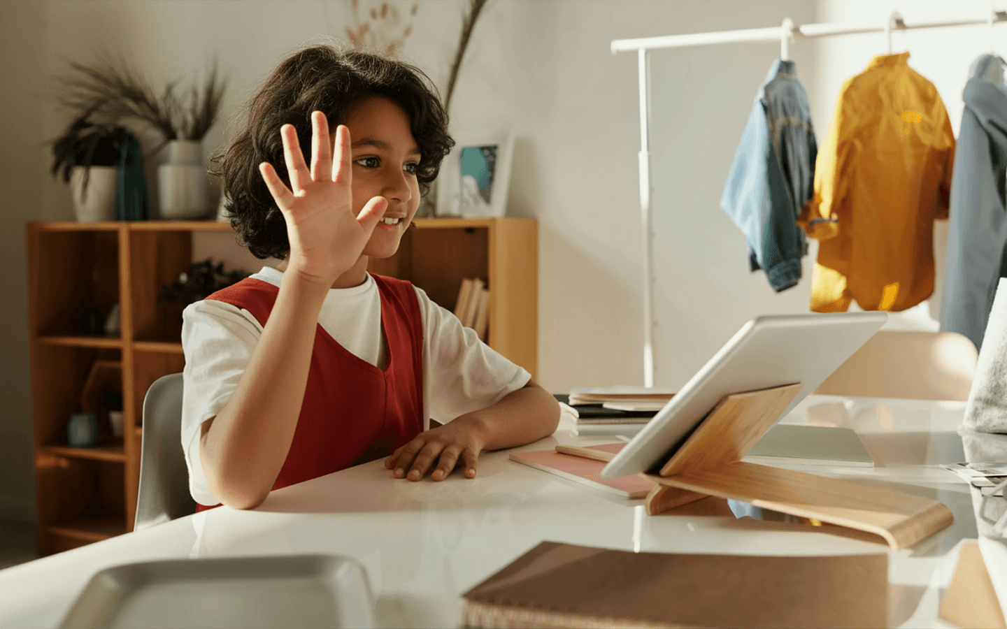 A happy student is on a video call, smiling and engaged