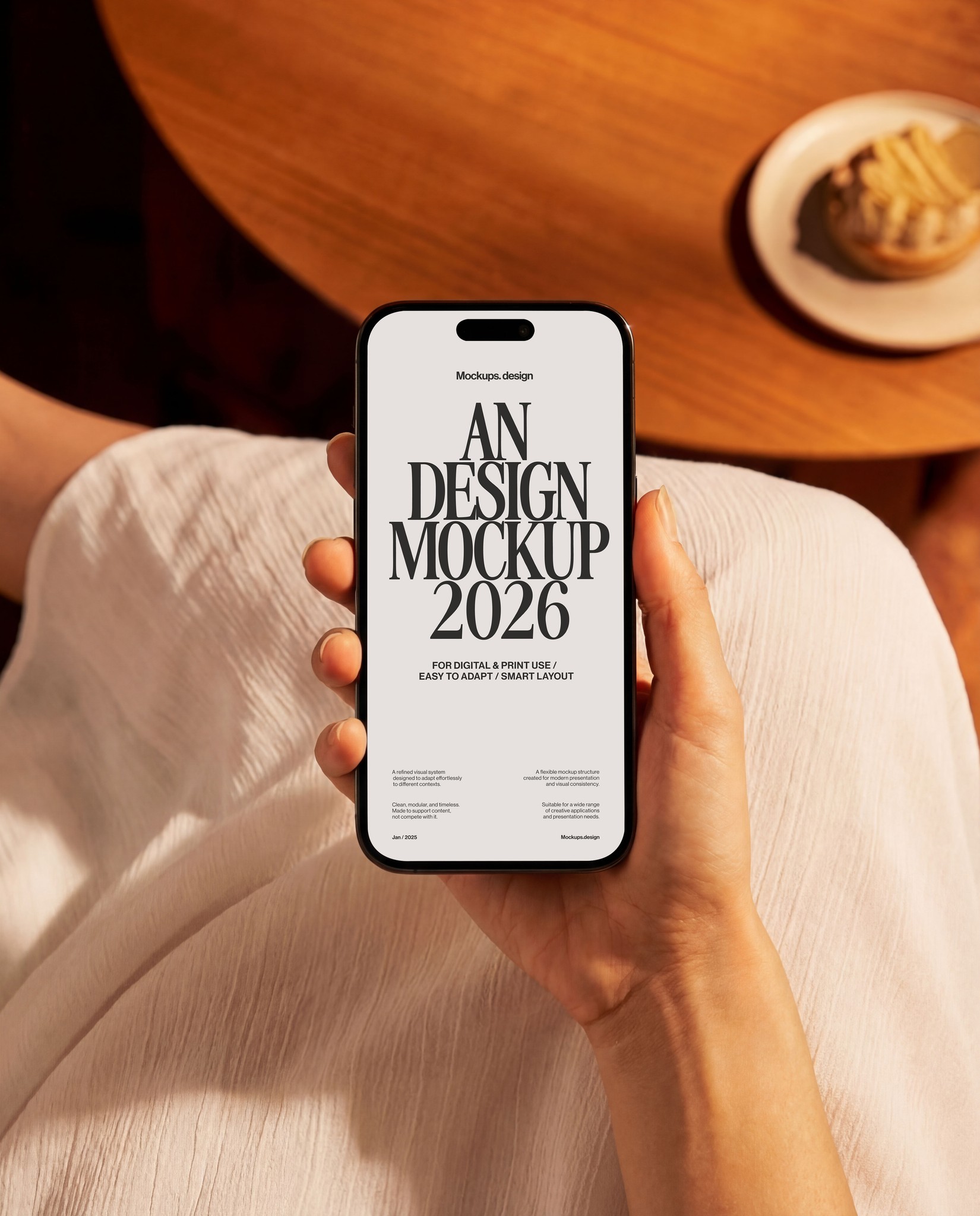 Hand holding iPhone 16 mockup showing app interface