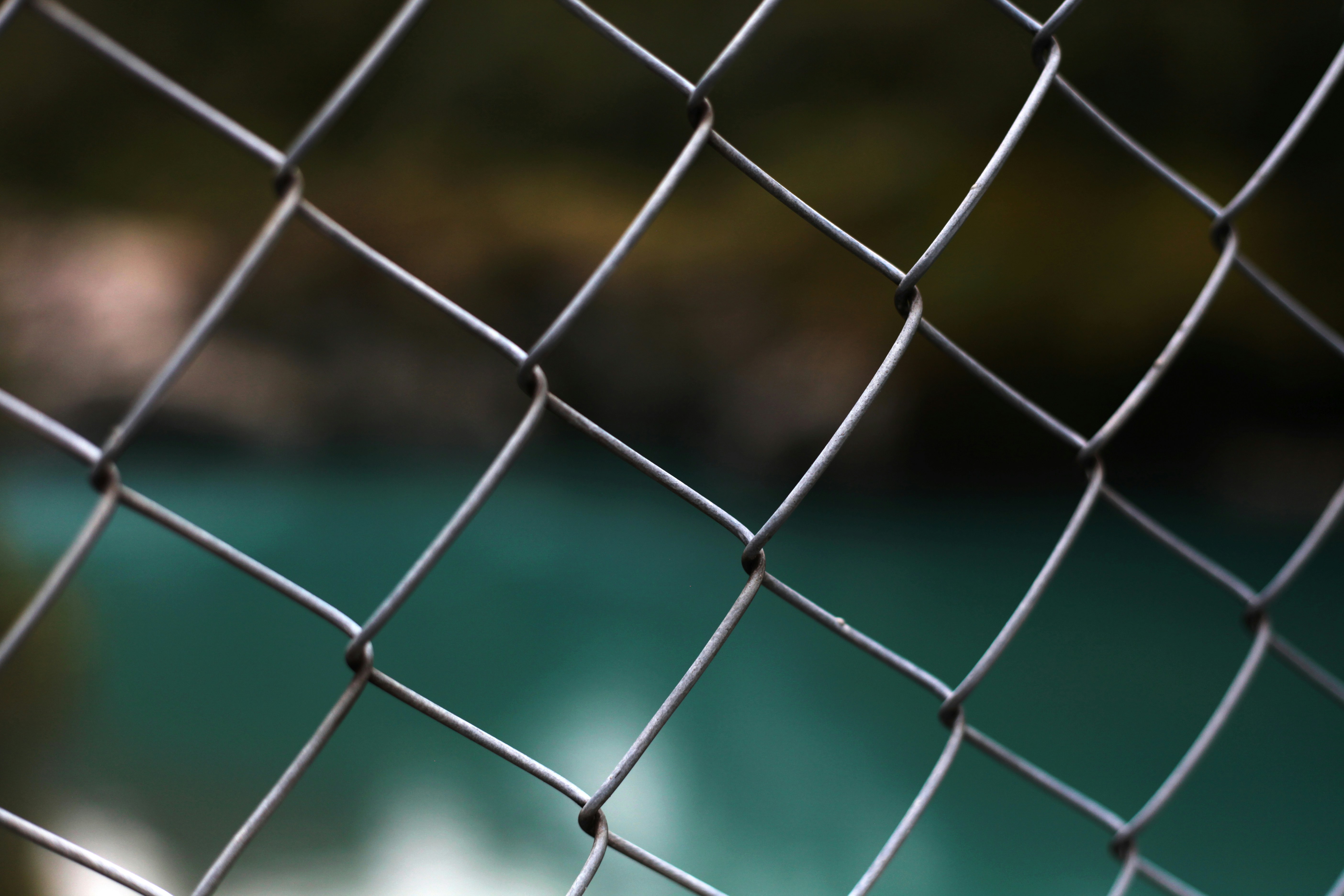 grey metal fence during daytime