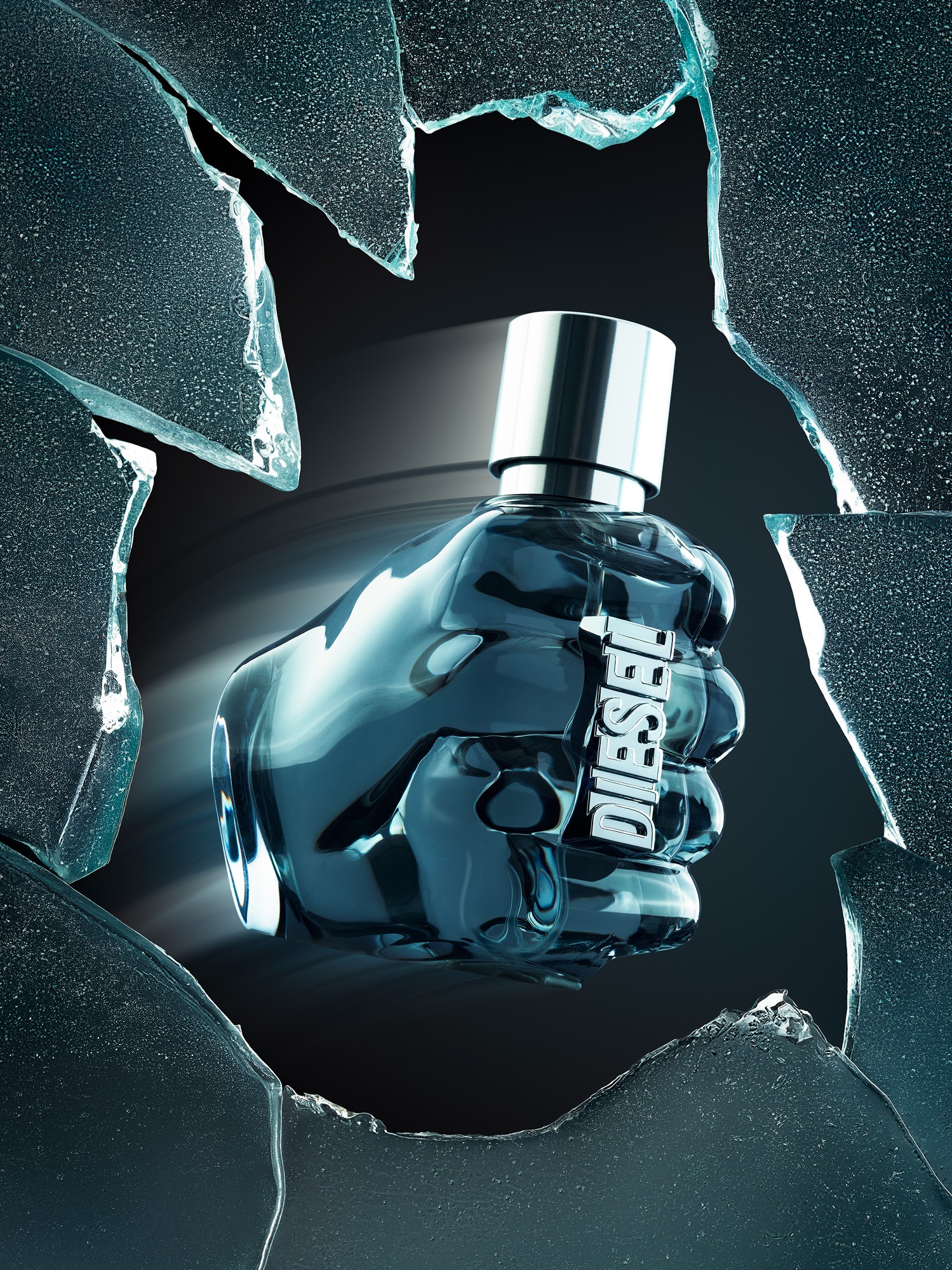 A bottle of Diesel "Only The Brave" perfume photographed in a studio where the environment resembles a smashed window. Photographed by Matthew Brown (A London product photographer).