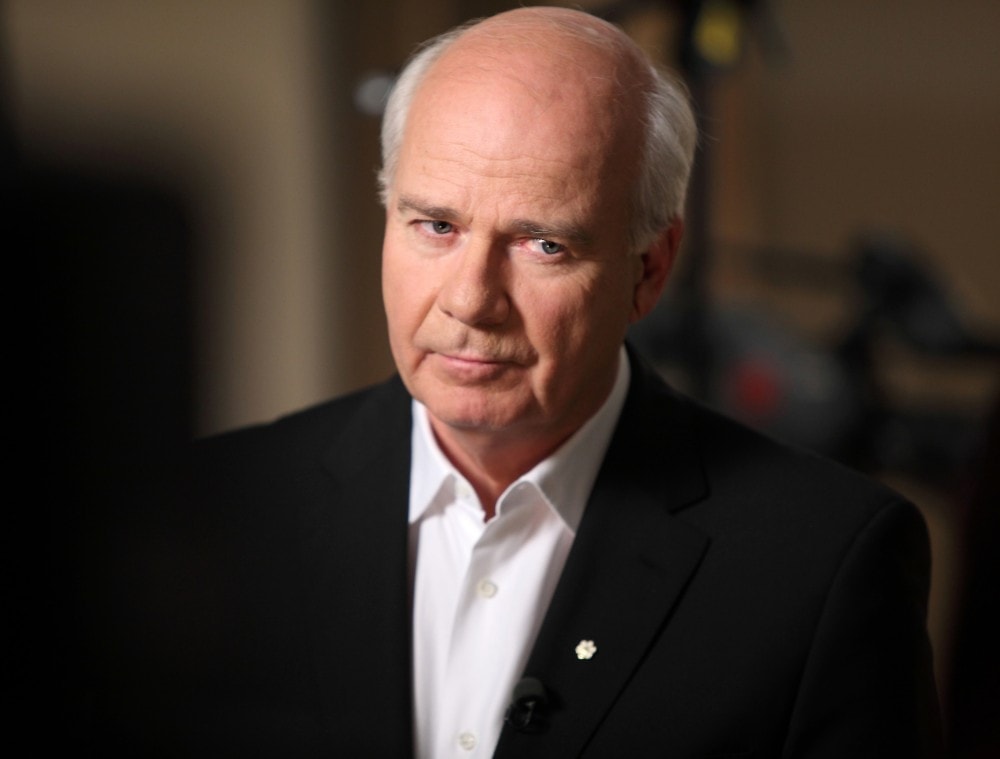 Peter Mansbridge, renowned news anchor and journalist, with a confident, approachable expression.