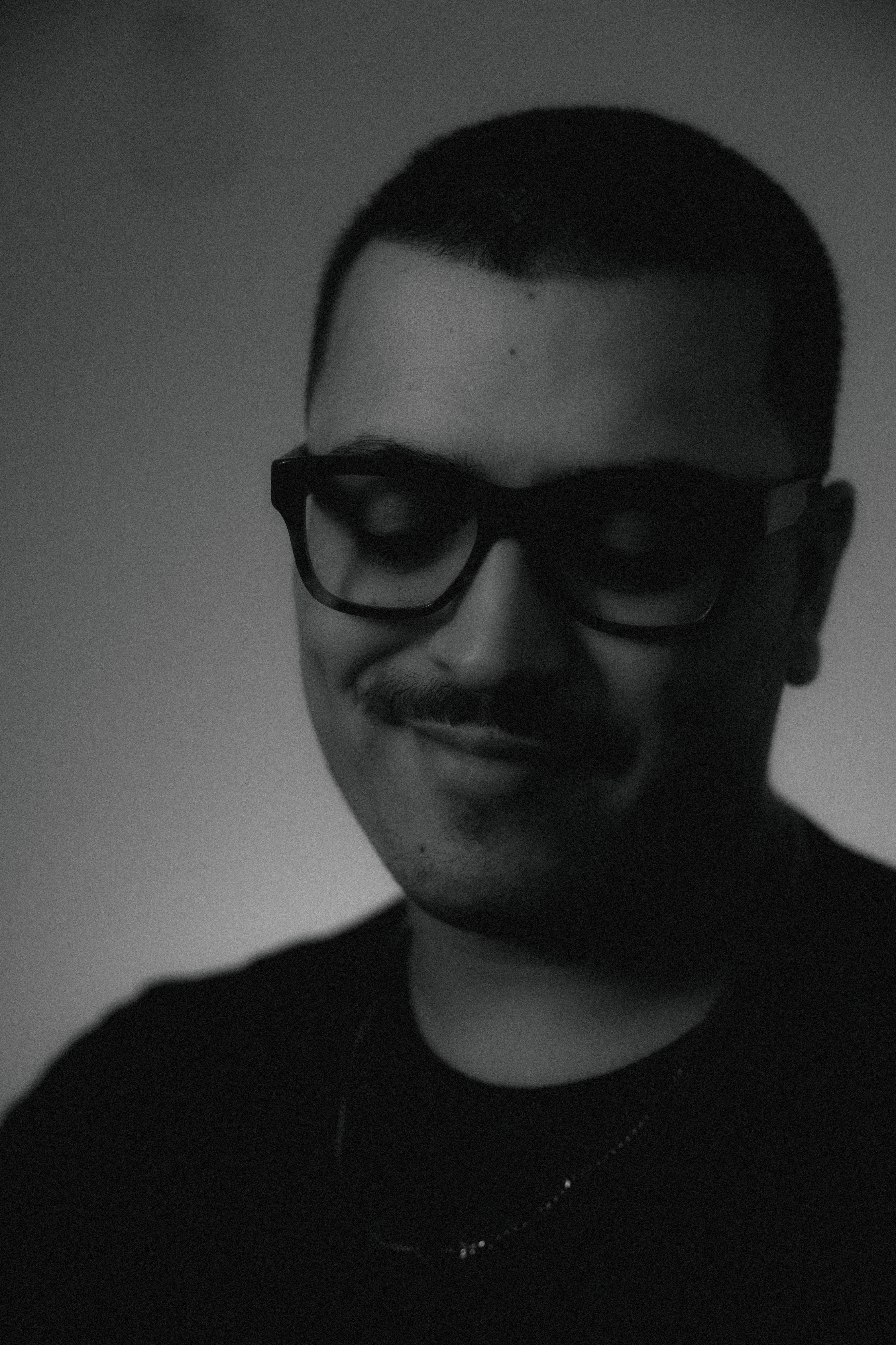 a blurry photo of a person standing in front of a wall