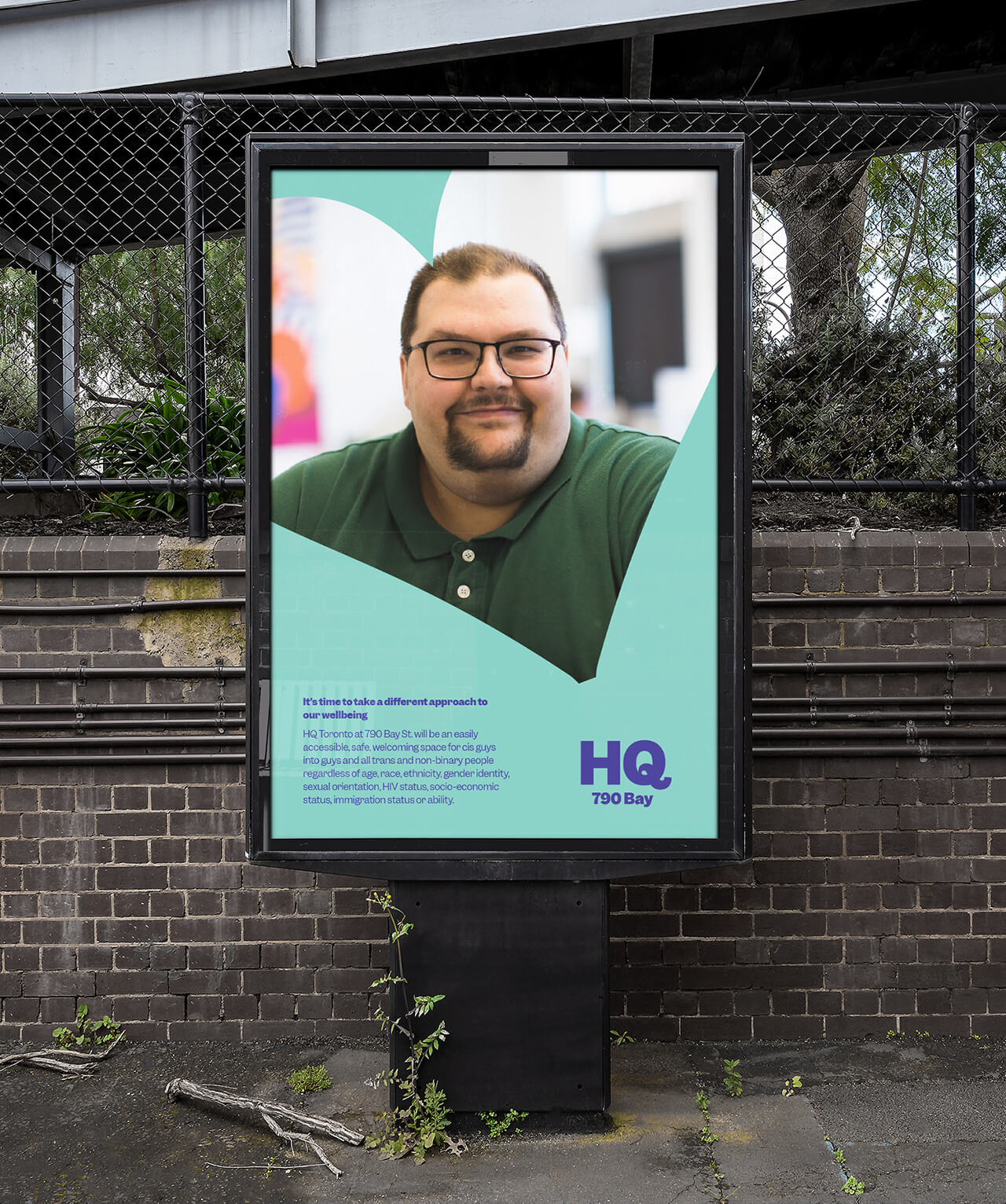 Digital billboard with an image of a smiling man, set on a brightly coloured background.