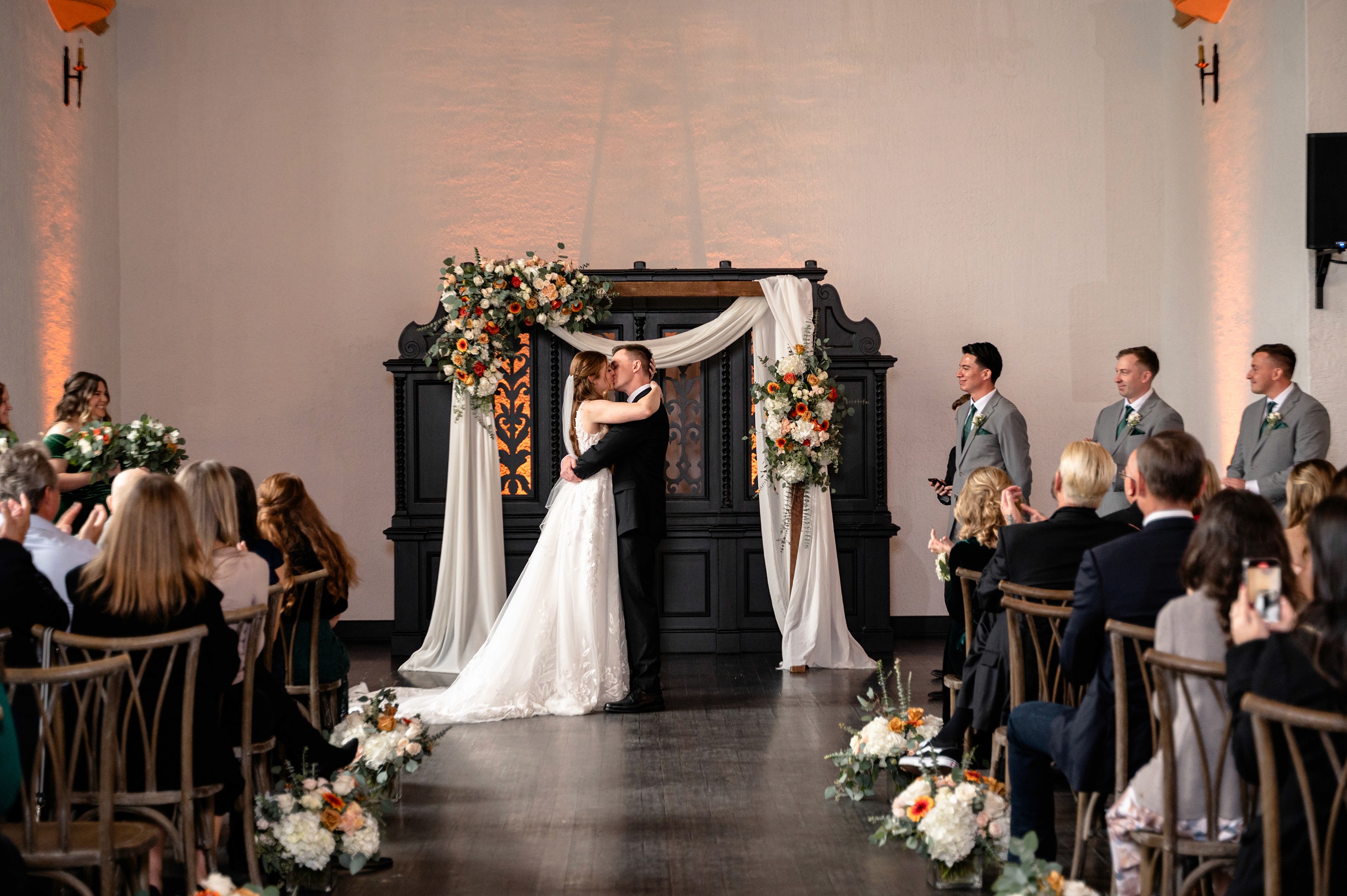 Flat lay wedding details with bouquet, rings, and sparkling bridal heels