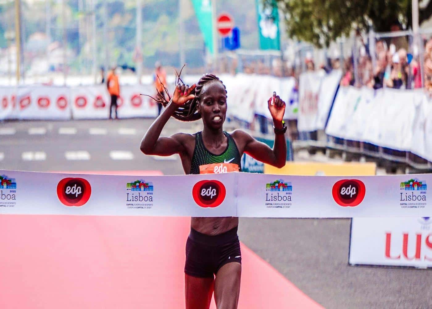 Woman crossing the finish line of a marathon
