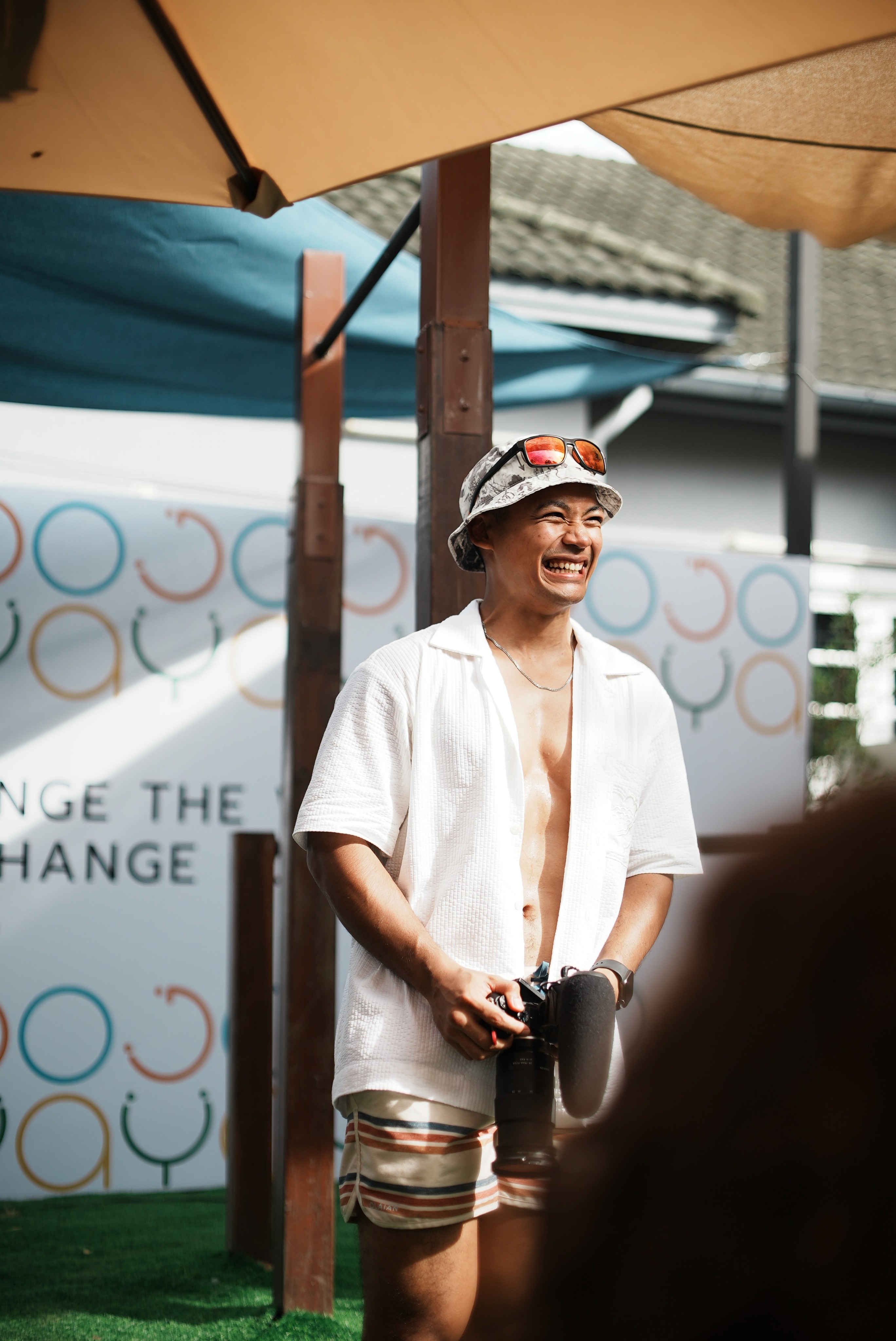 young man standing in front of a building