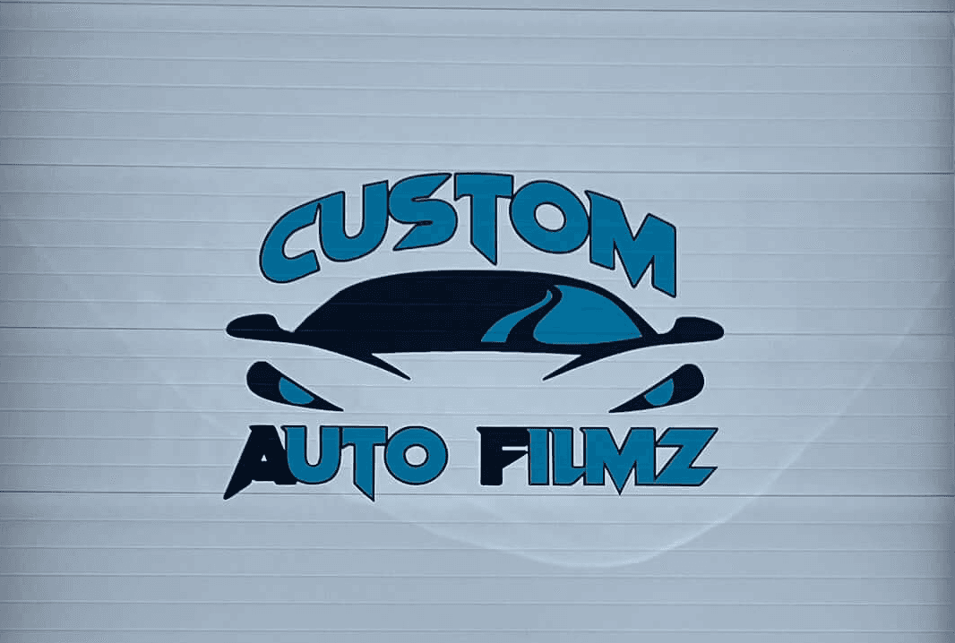 A garage door with custom vinyl business graphics.