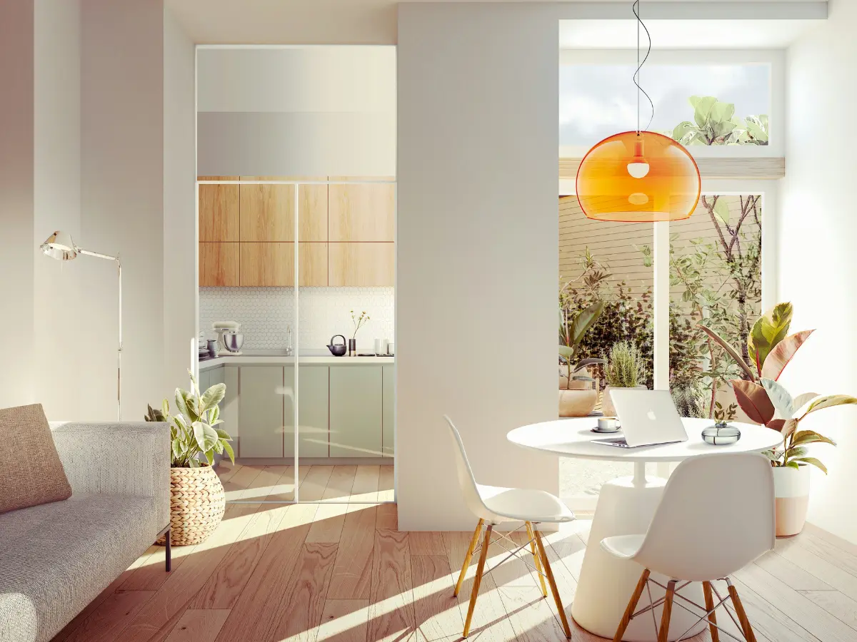 A wooden cube teeters on the edge of a rectangular block against a plain background.