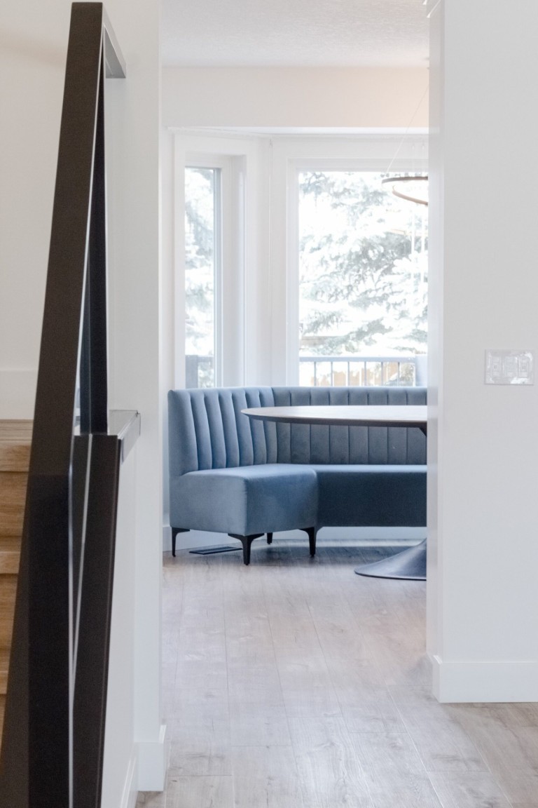 Image of KHD Homes interior design featuring a cozy seating area with furniture and modern window coverings layout.