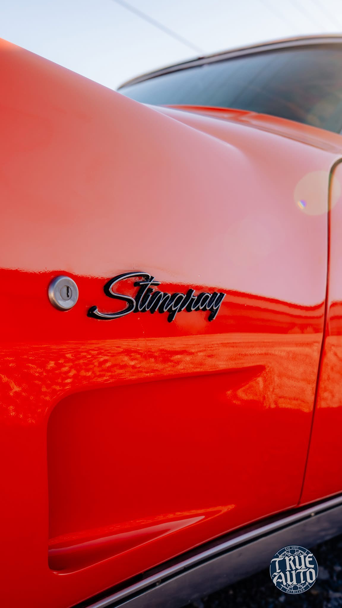 red logo on the side of a car