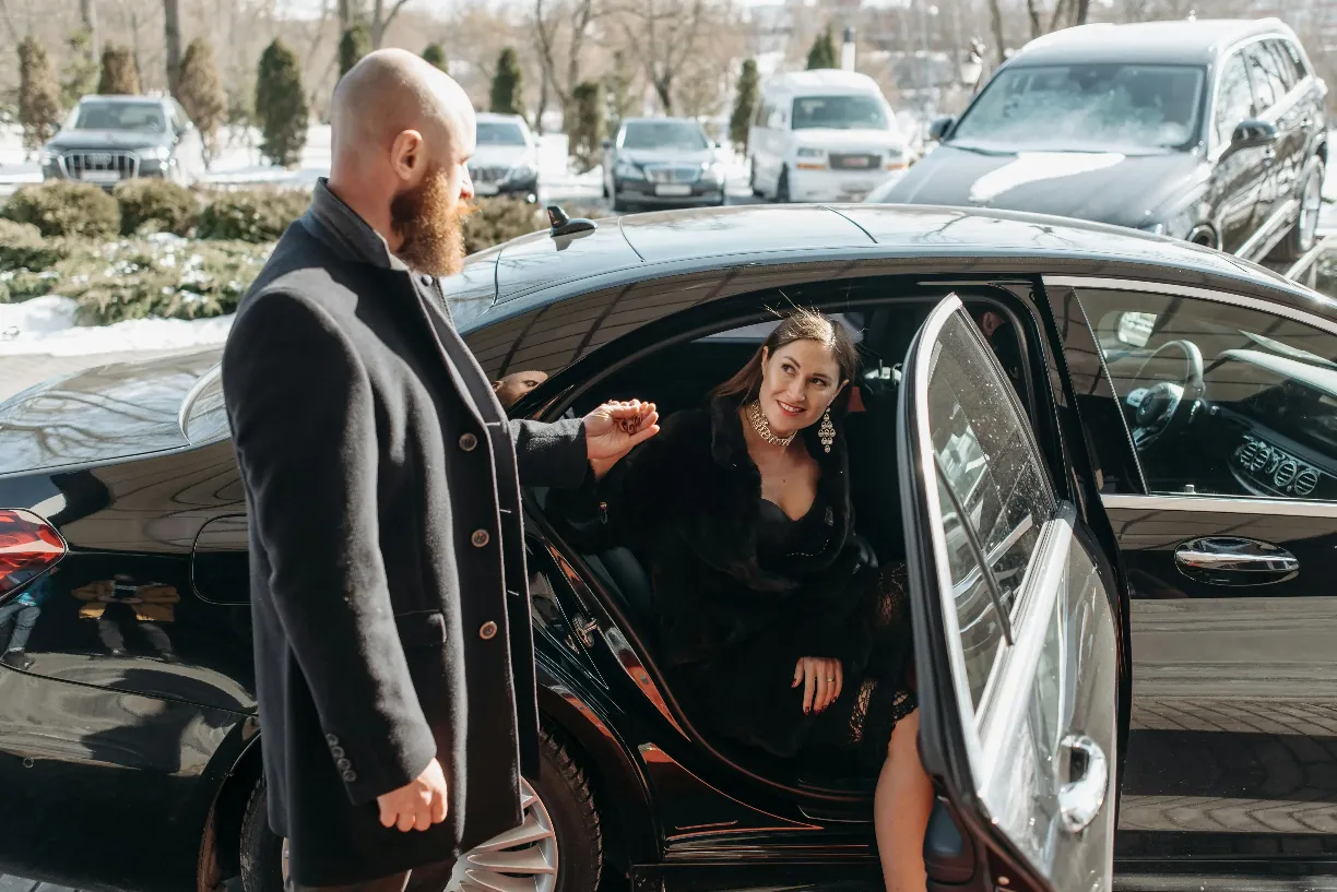stylish-couple-stepping-out-of-a-luxury-black-car,-emphasizing-elegance-and-soph - pavel-danilyuk (pexels)