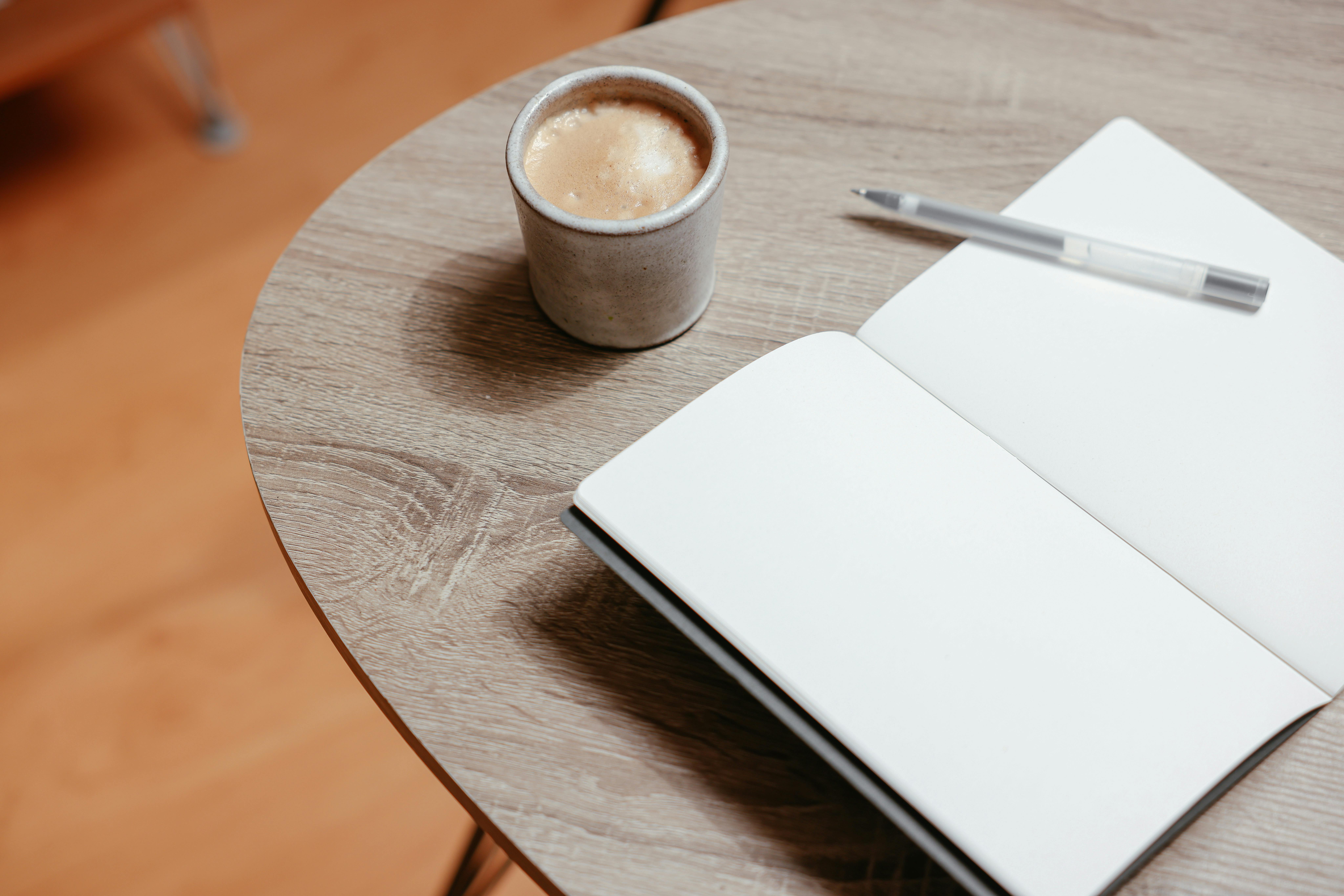 woman in blue tank top standing beside white wall