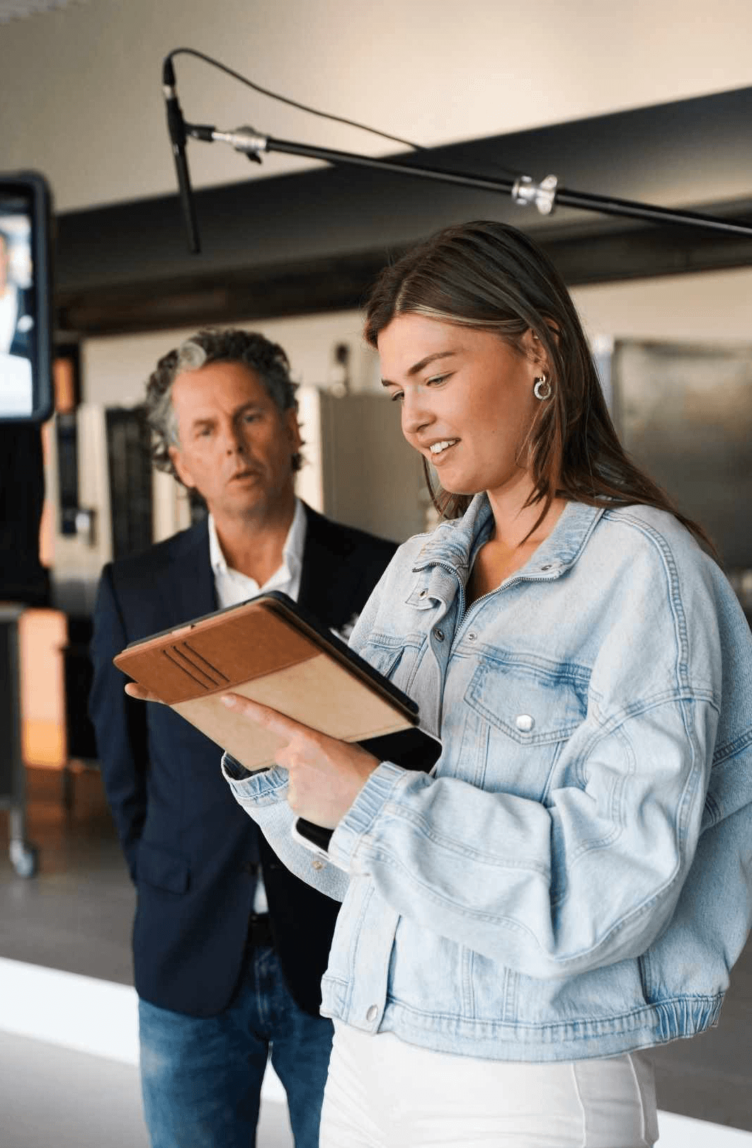 Empty room with wooden floor and large window.
