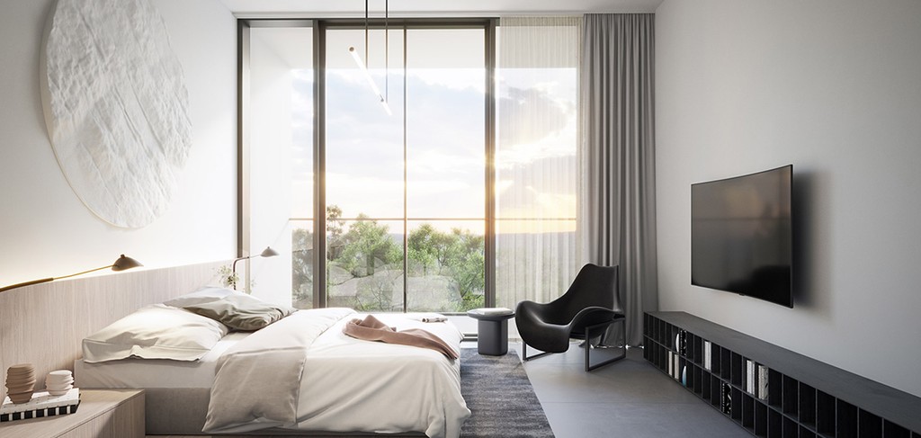 A modern bedroom with a large window displaying the city view, located in The Gate 5.