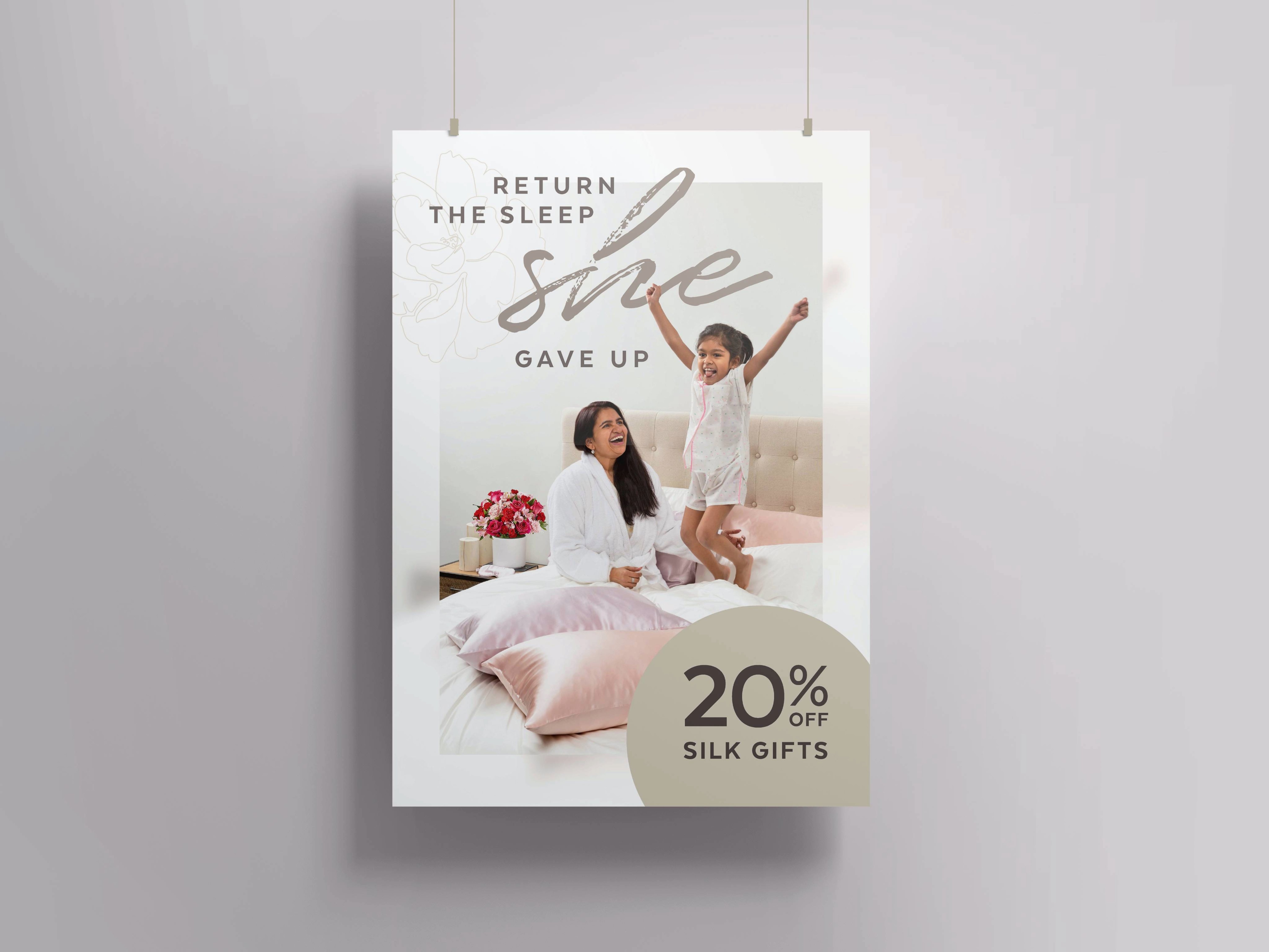 QE Home in-store poster promoting 20% off Silk Gifts with Mother's Day lifestyle imagery