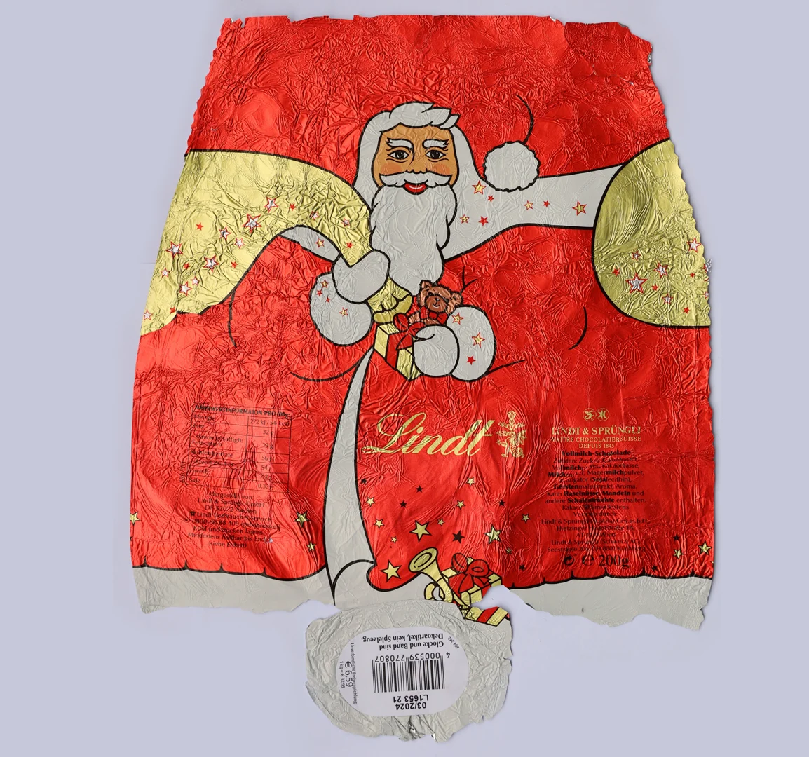The wrapper of the chocolate Santa Claus, stretched out and flattened.