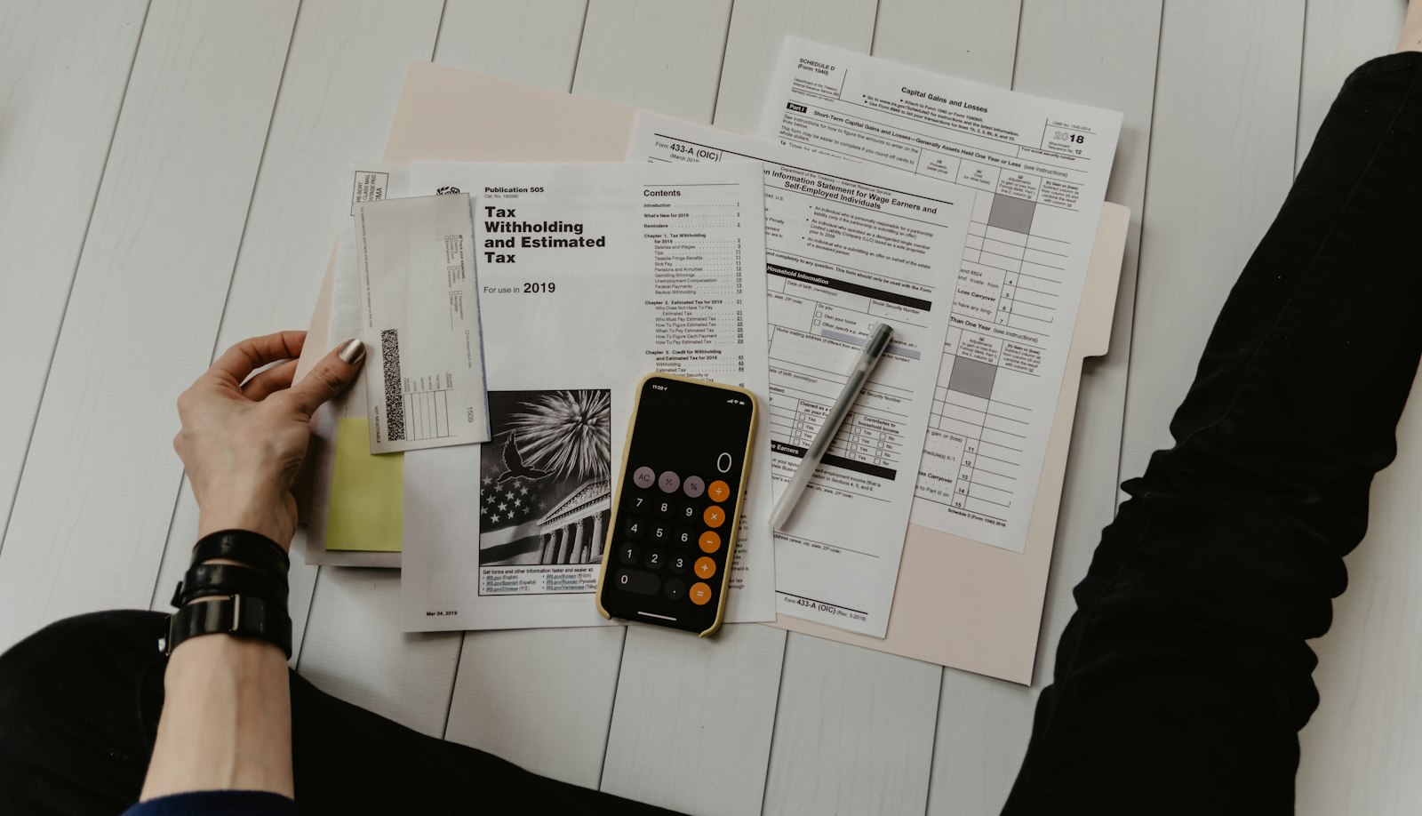 Paper bills, forms and a calculator