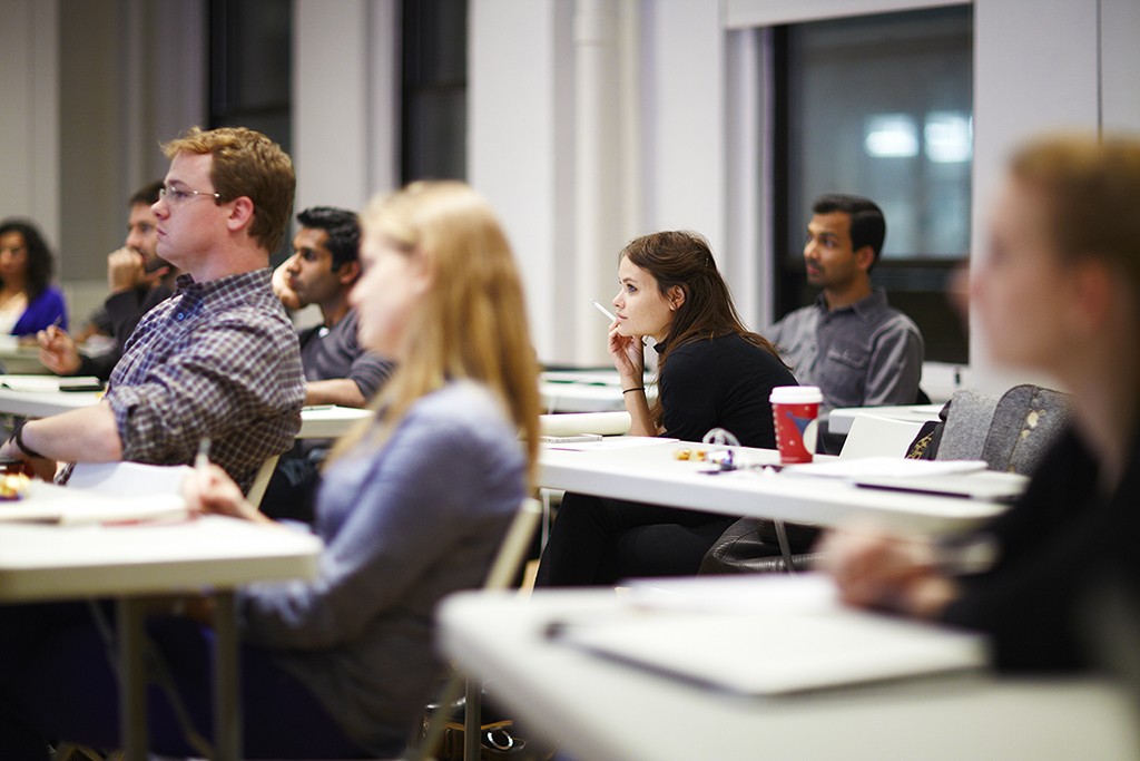 A learner working through a design challenge with calm focus and visible engagement.