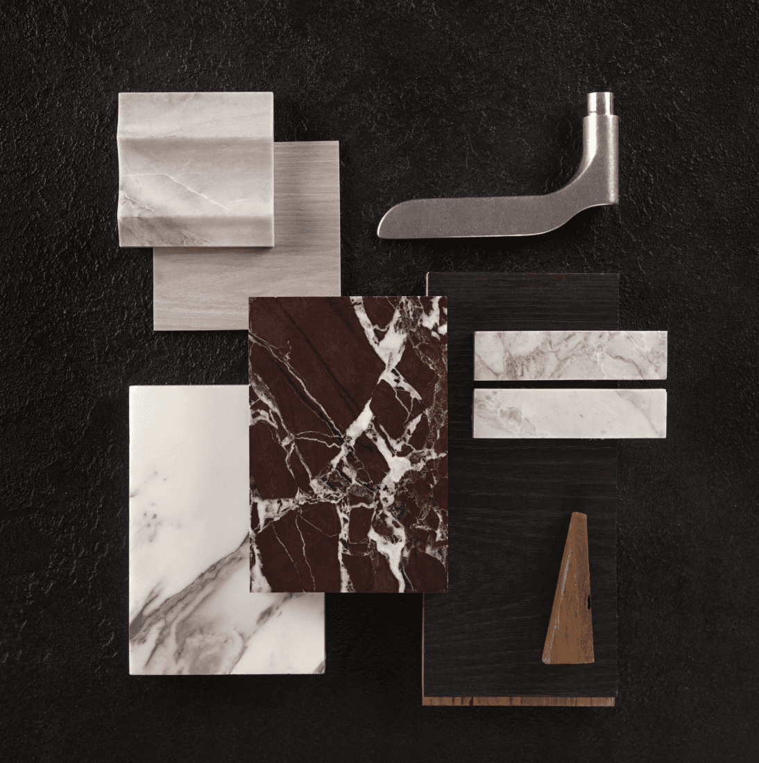 Curated palette of marble samples and brushed metal finishes on a dark background.