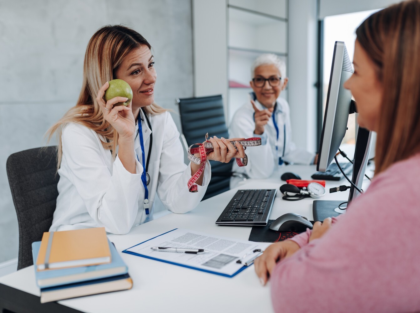 woman meeting with a dietitian to discuss nutrition support for her safe medicine for weight loss