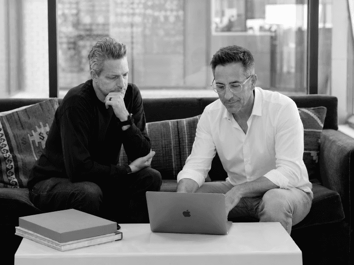 Team working in an office watching at a presentation
