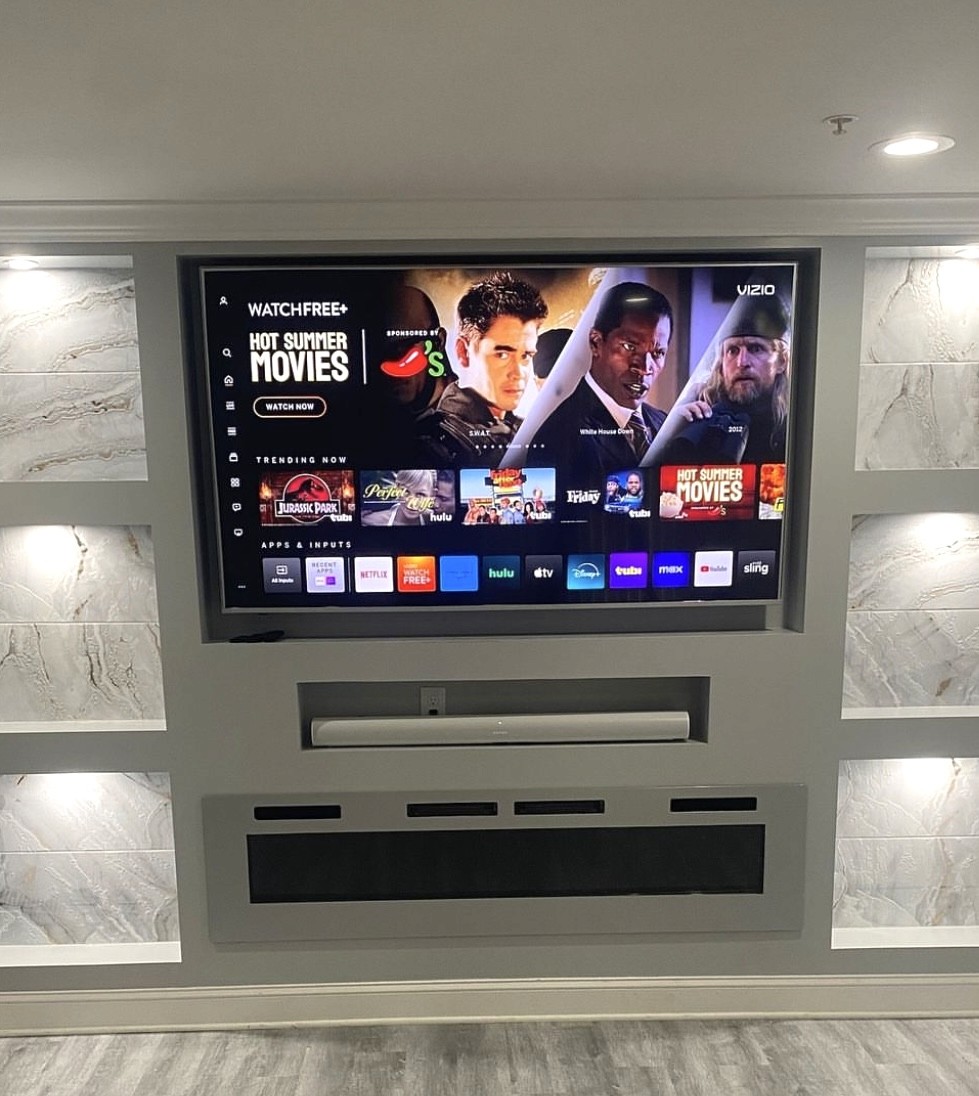 85 inch TV Mounted with white marble background