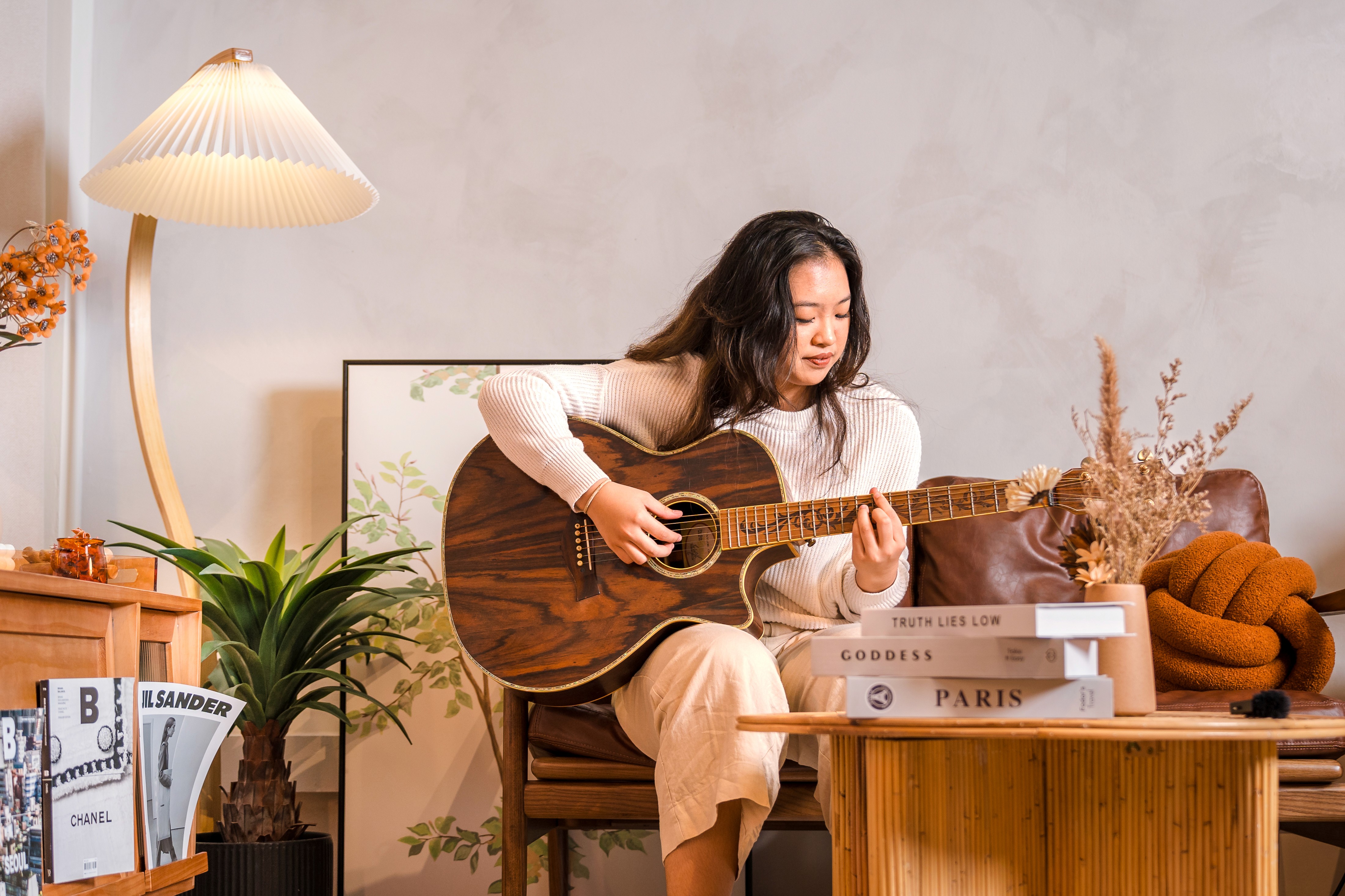 Candid shot featuring Lana Lajarca with the acoustic guitar, captured by AKAR Studios