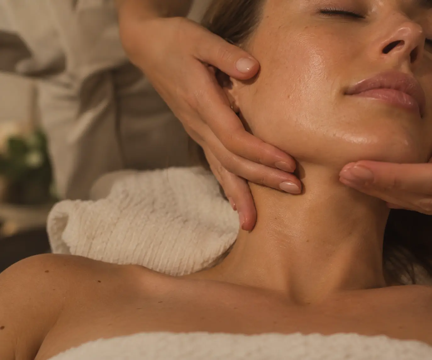 Young woman at Afiya Spa with glowing skin after recieving facial treatment