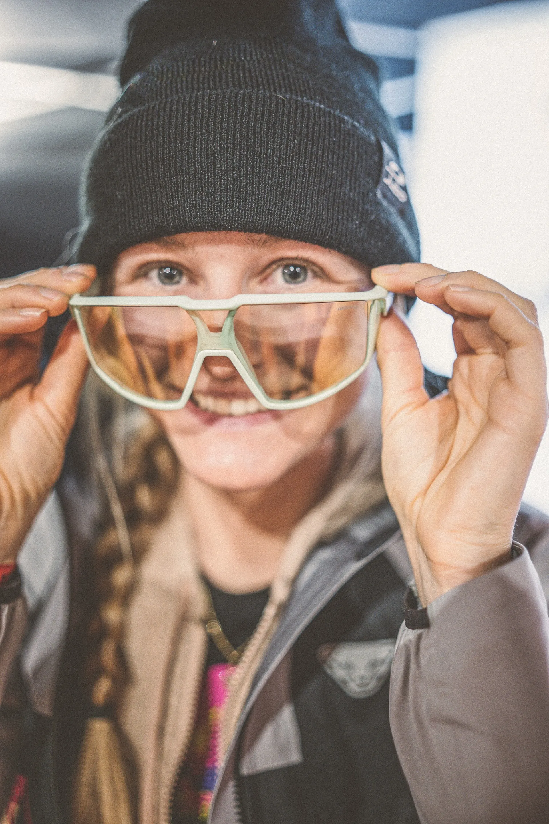 Portrait of a Julbo athlete adjusting her ski goggles before the Pierra Menta race