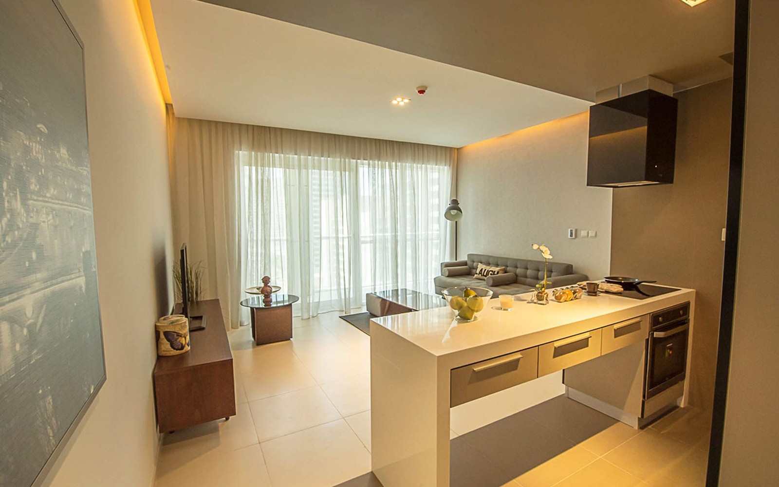 A small apartment featuring a kitchen and living room, located in West Avenue Tower.