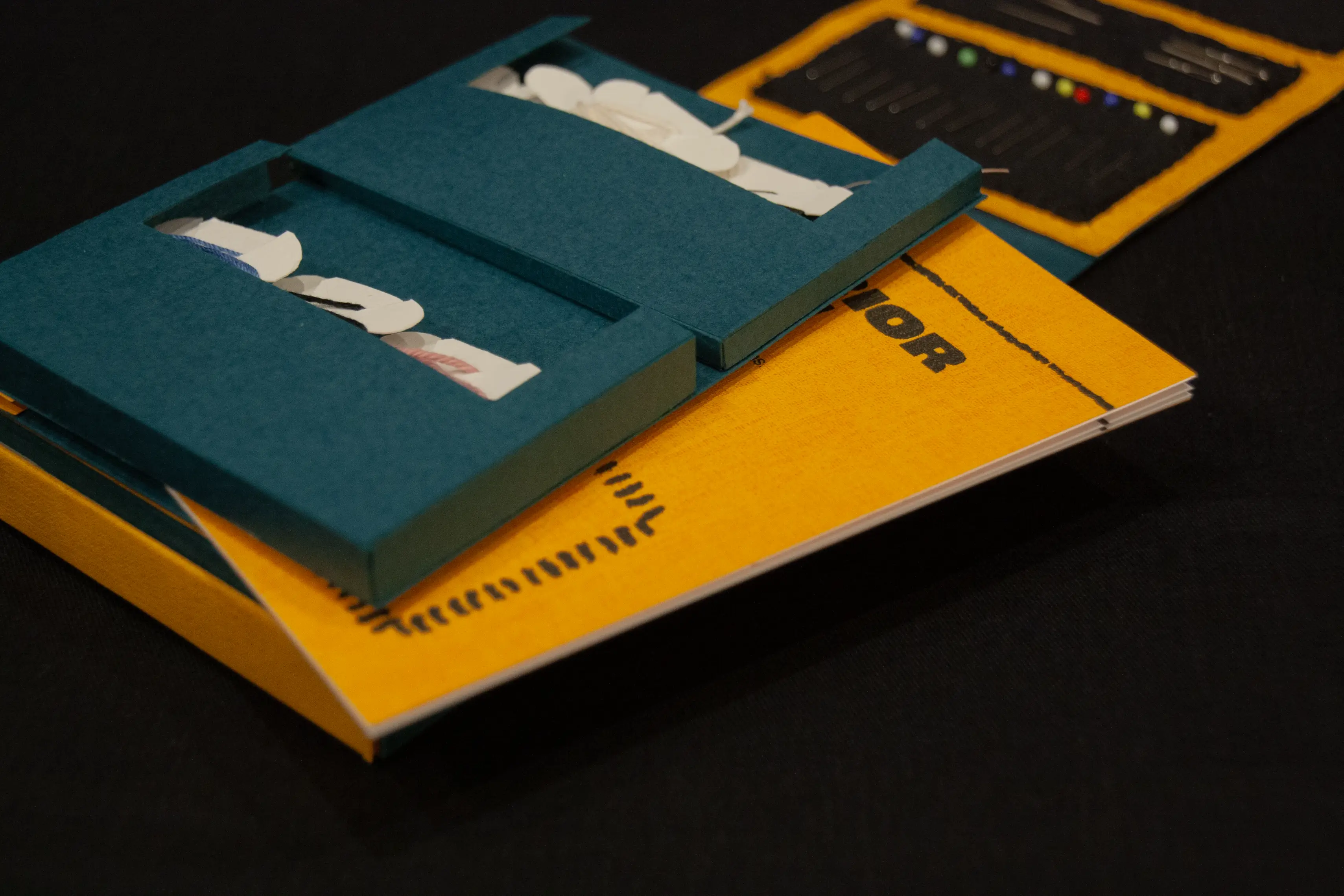 Close-up of a booklet stored within the mending kit