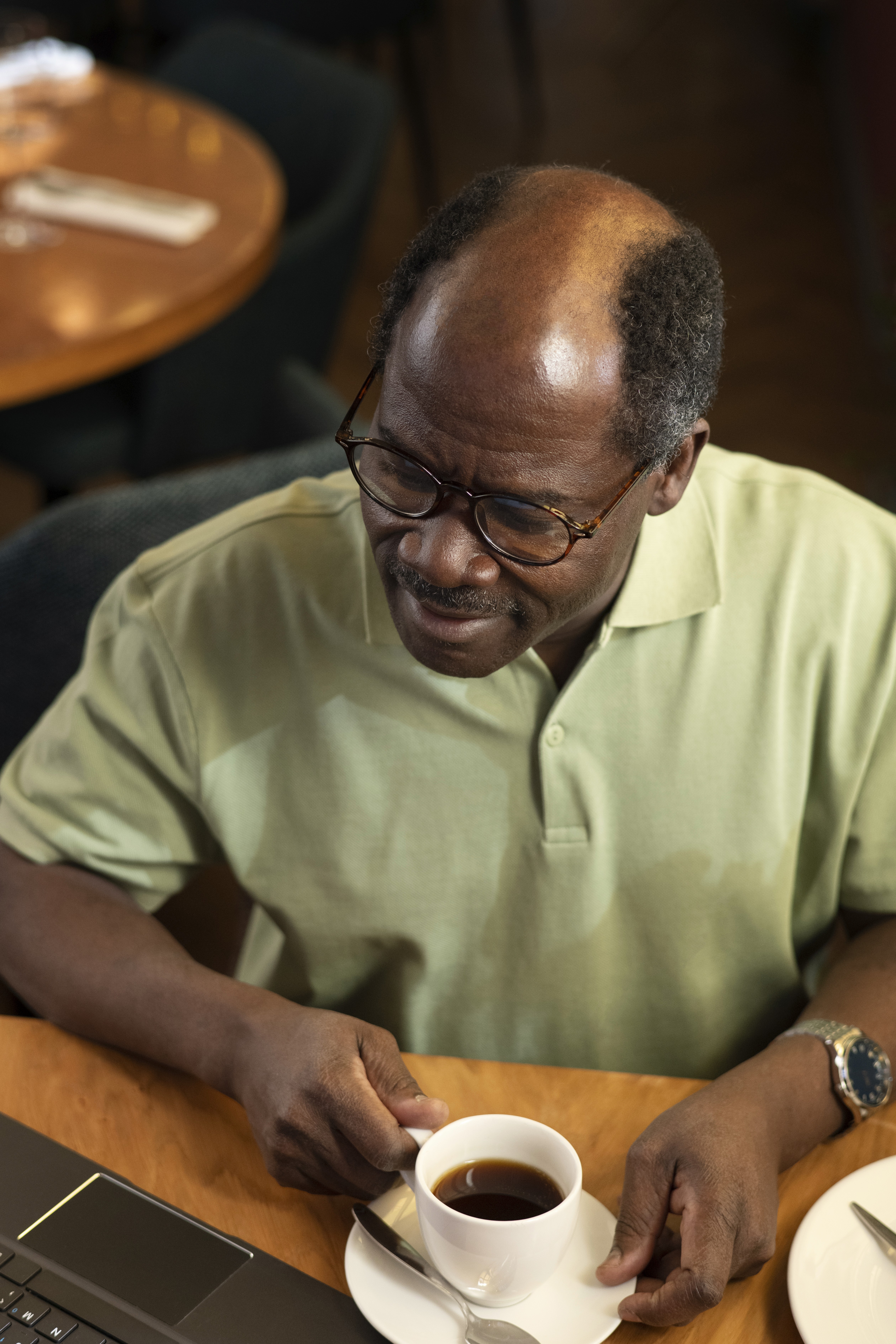 Older man drinking a coffee