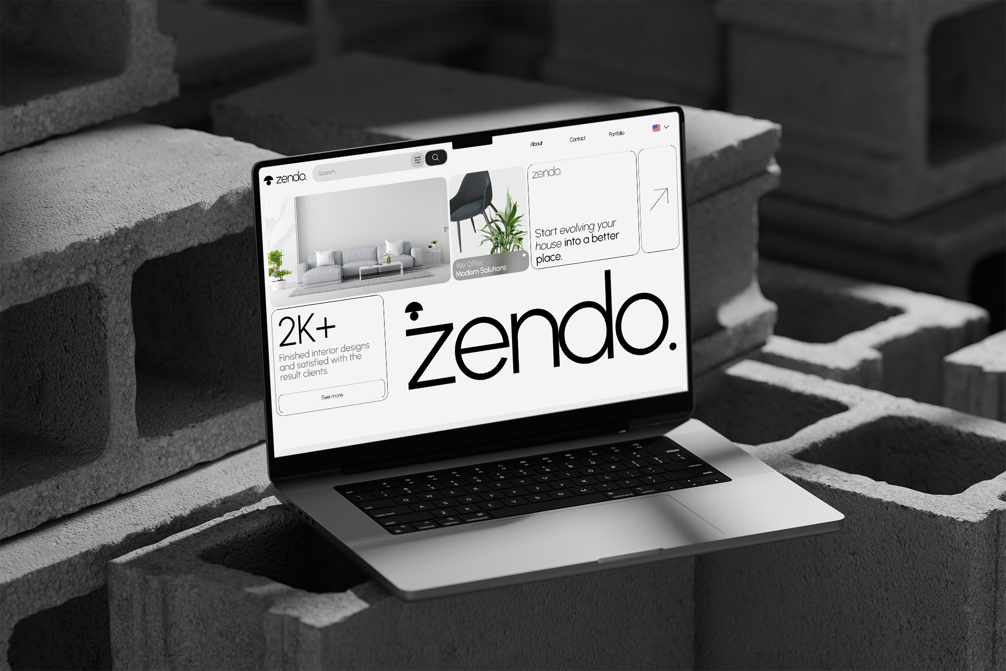 Laptop on concrete bricks, website on screen