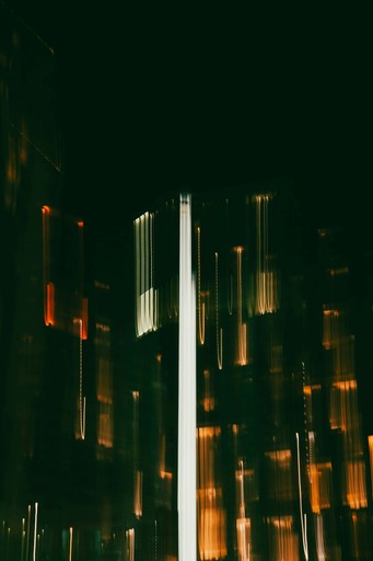 Abstract streaks of light from city buildings at night
