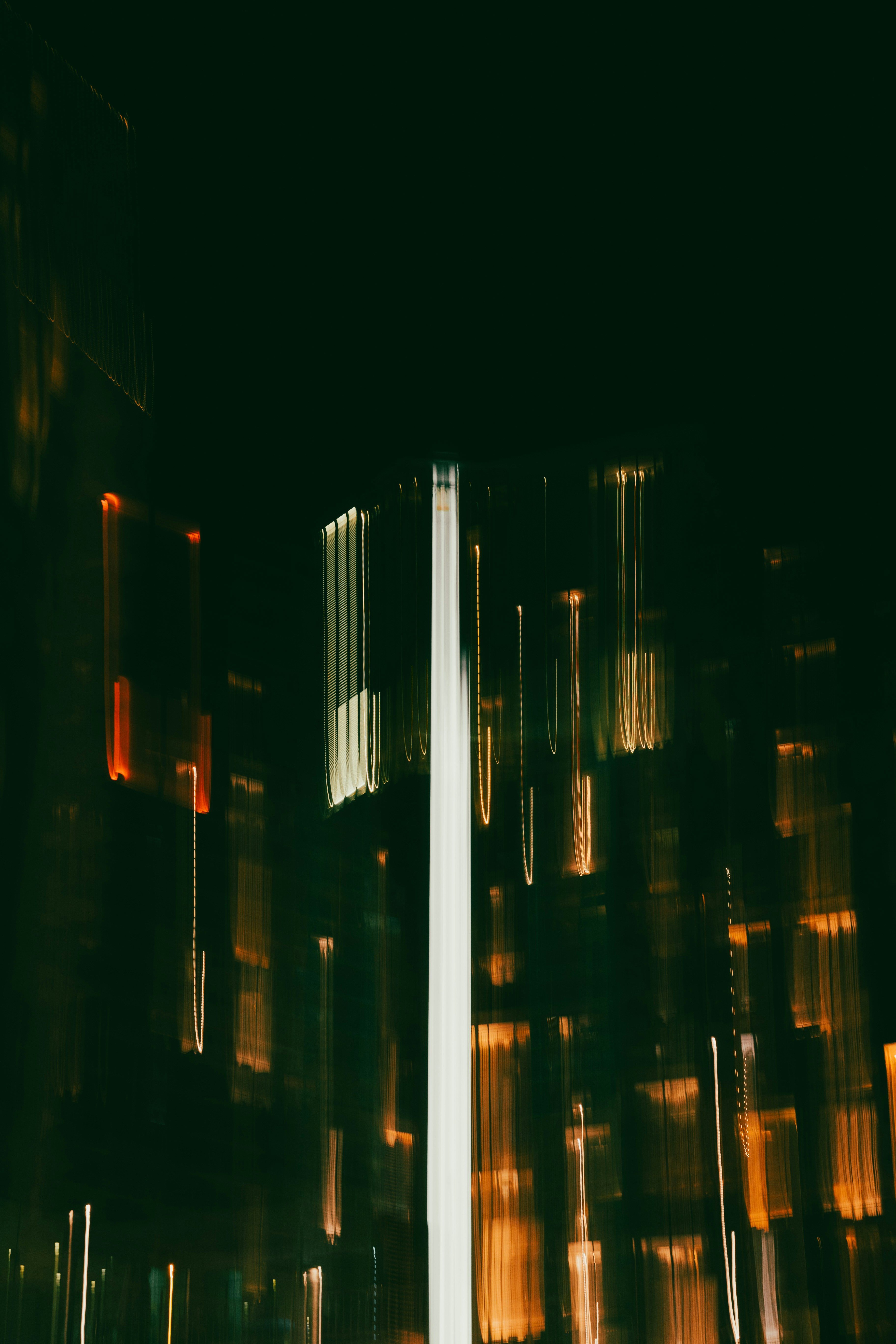 Abstract streaks of light from city buildings at night