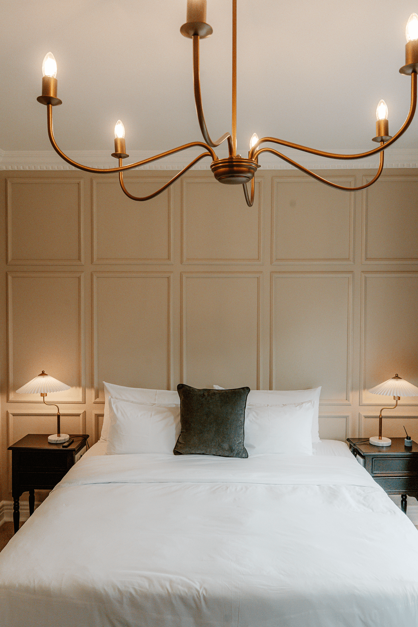 Elegant bedroom in Executive Suite with king-size bed and estate views.