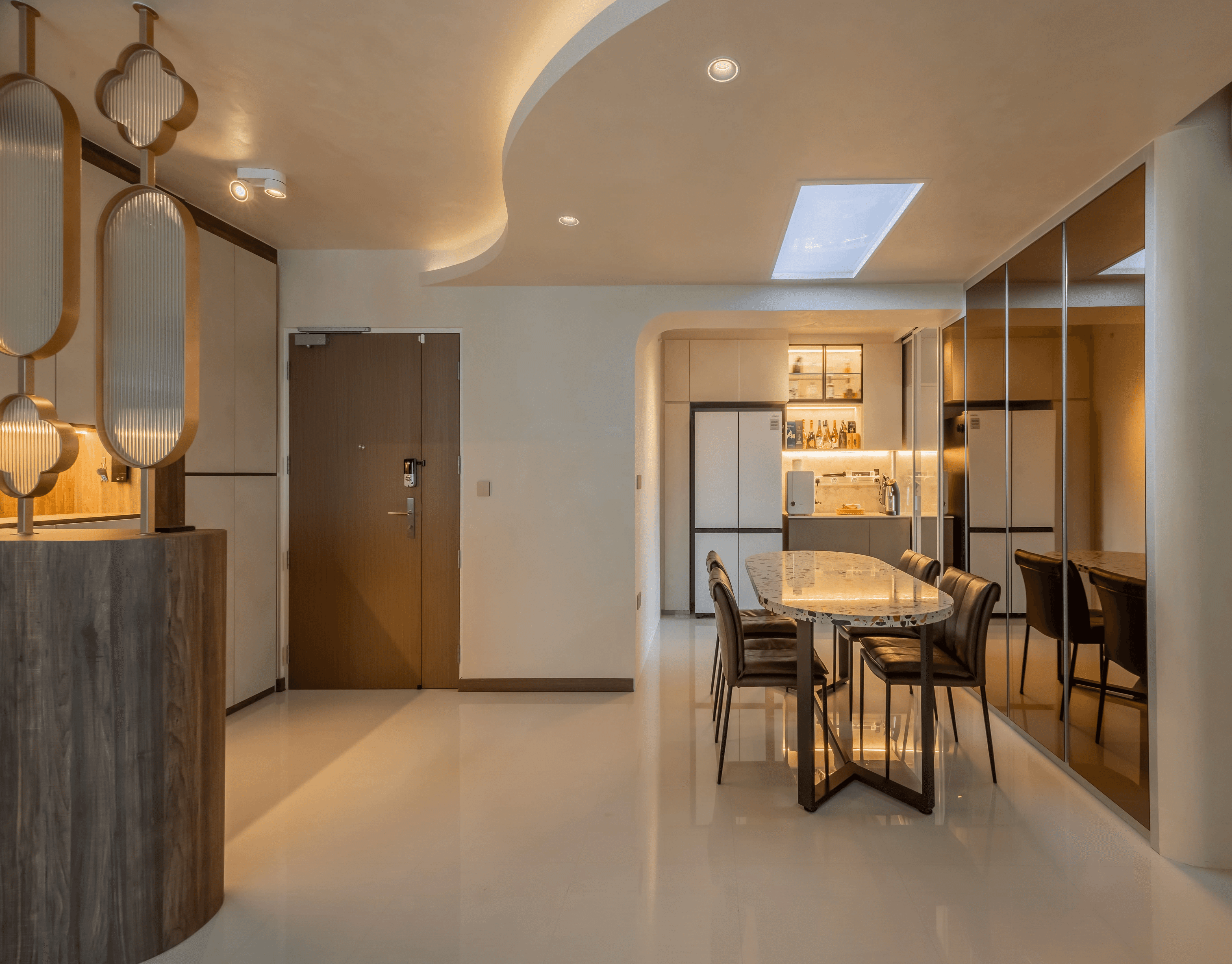 Modern dining area with wood accents and statement pendant lighting.