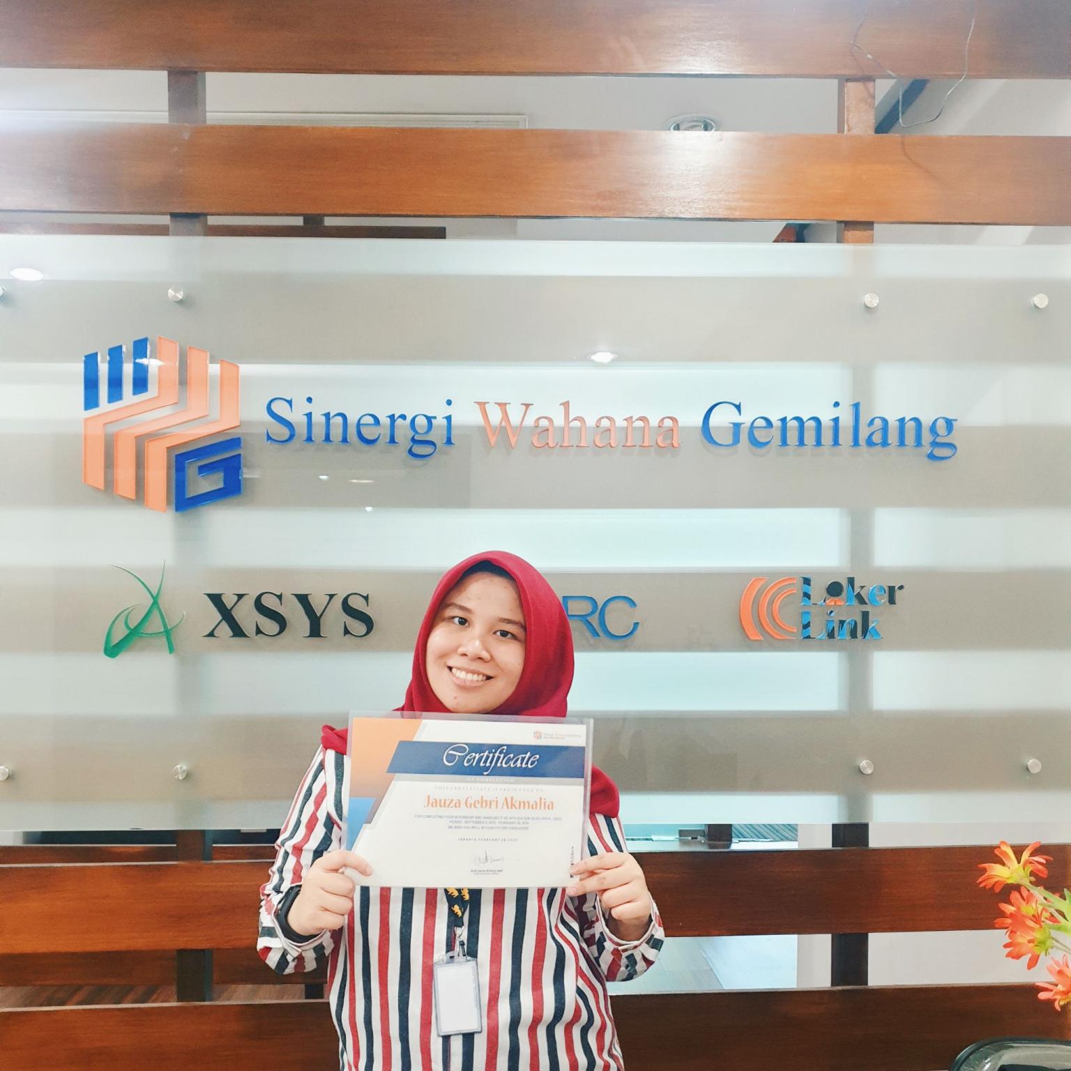 Person inserting sd card into laptop