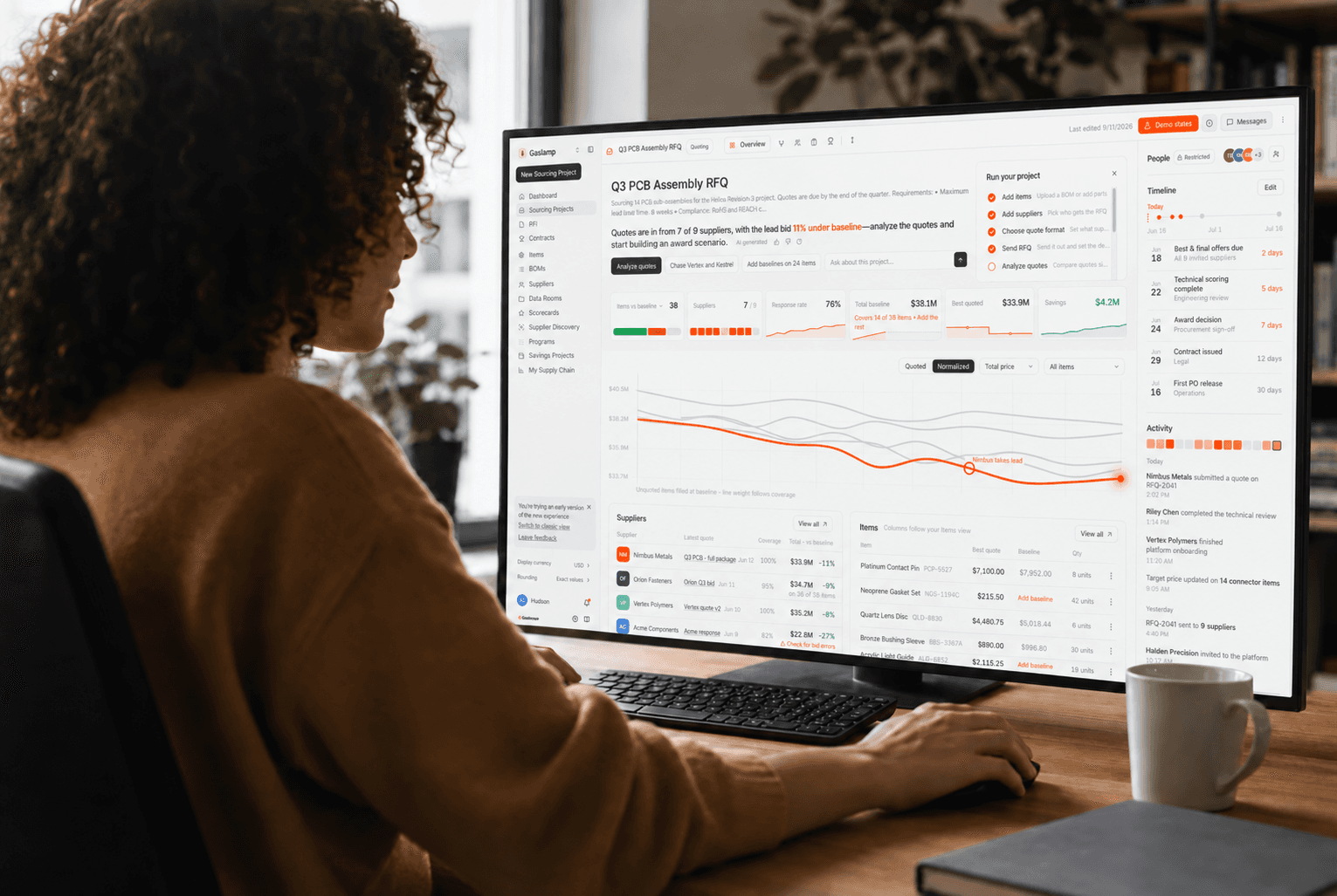 Person reviewing the LightSource cost analysis dashboard for an EV chassis assembly on a desktop monitor