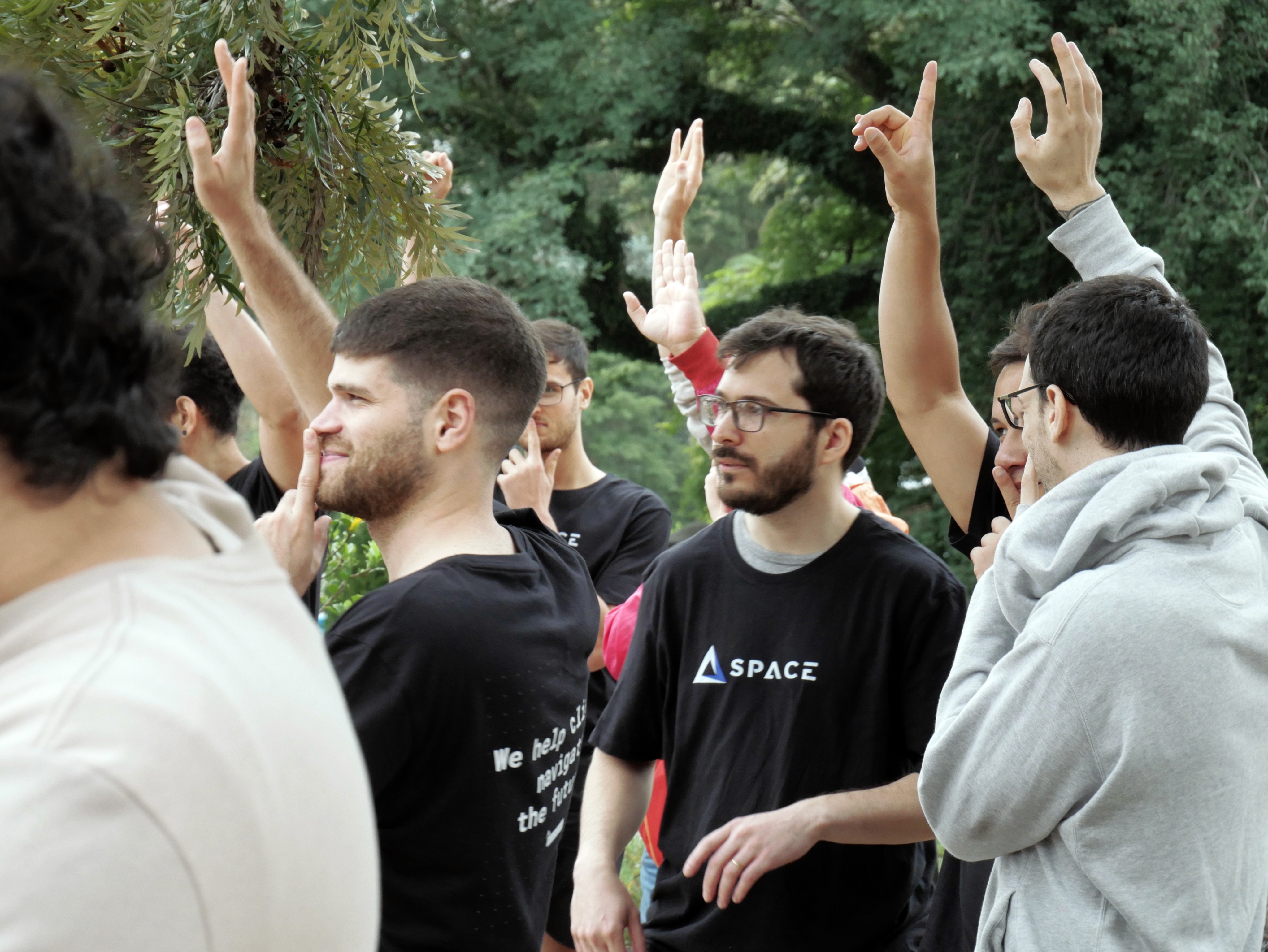 SpaceDev team members enjoying a team-bonding activity at a park, engaging in outdoor fun.