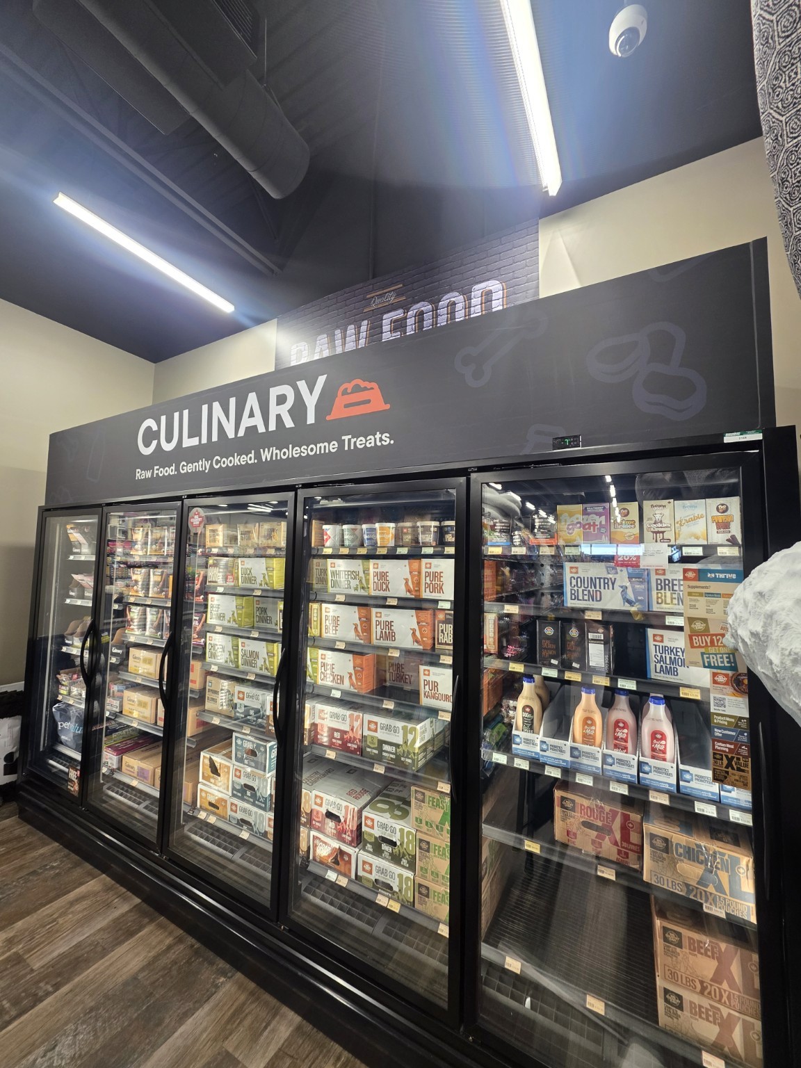 Completed Pet Valu freezer-shroud vinyl installation