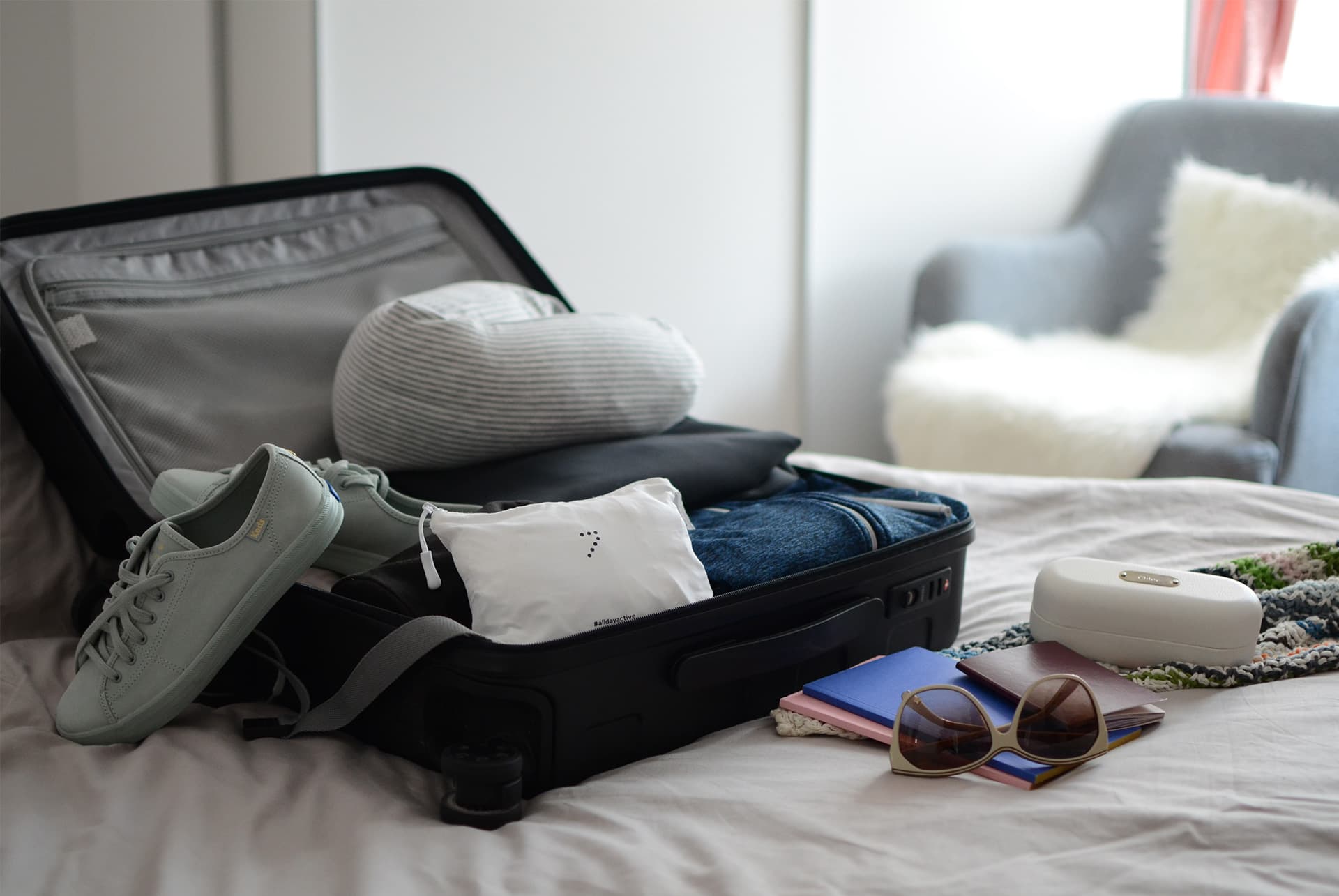 Streetside billboard with flyposters of the Batch.Works brand and illustrations