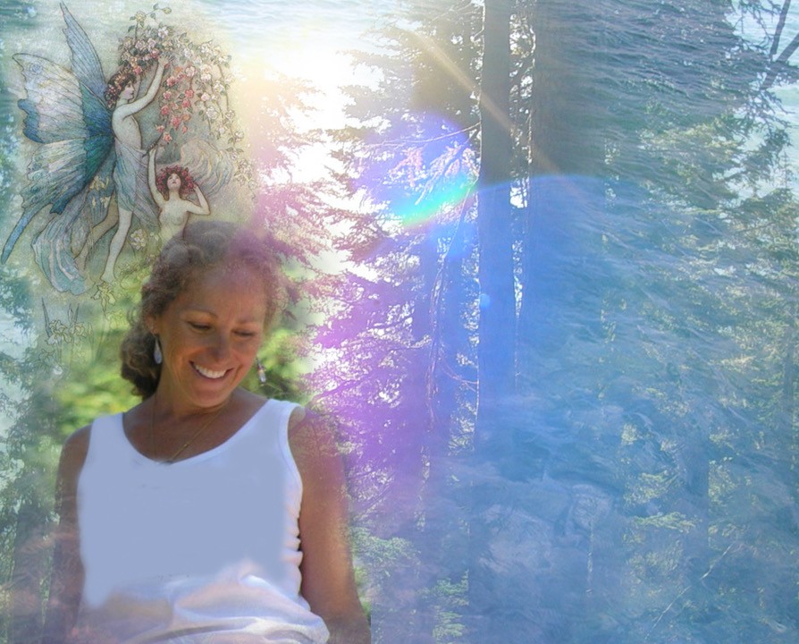 A winding road cuts through rocky terrain, surrounded by patches of green grass and illuminated by sunlight.