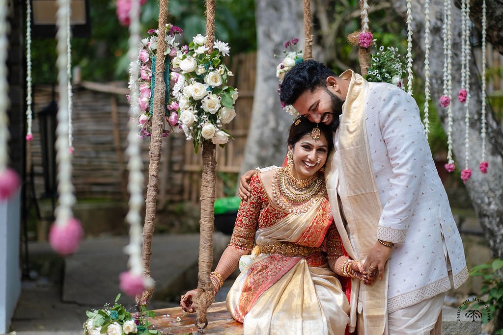A bride in a white gown and a groom.