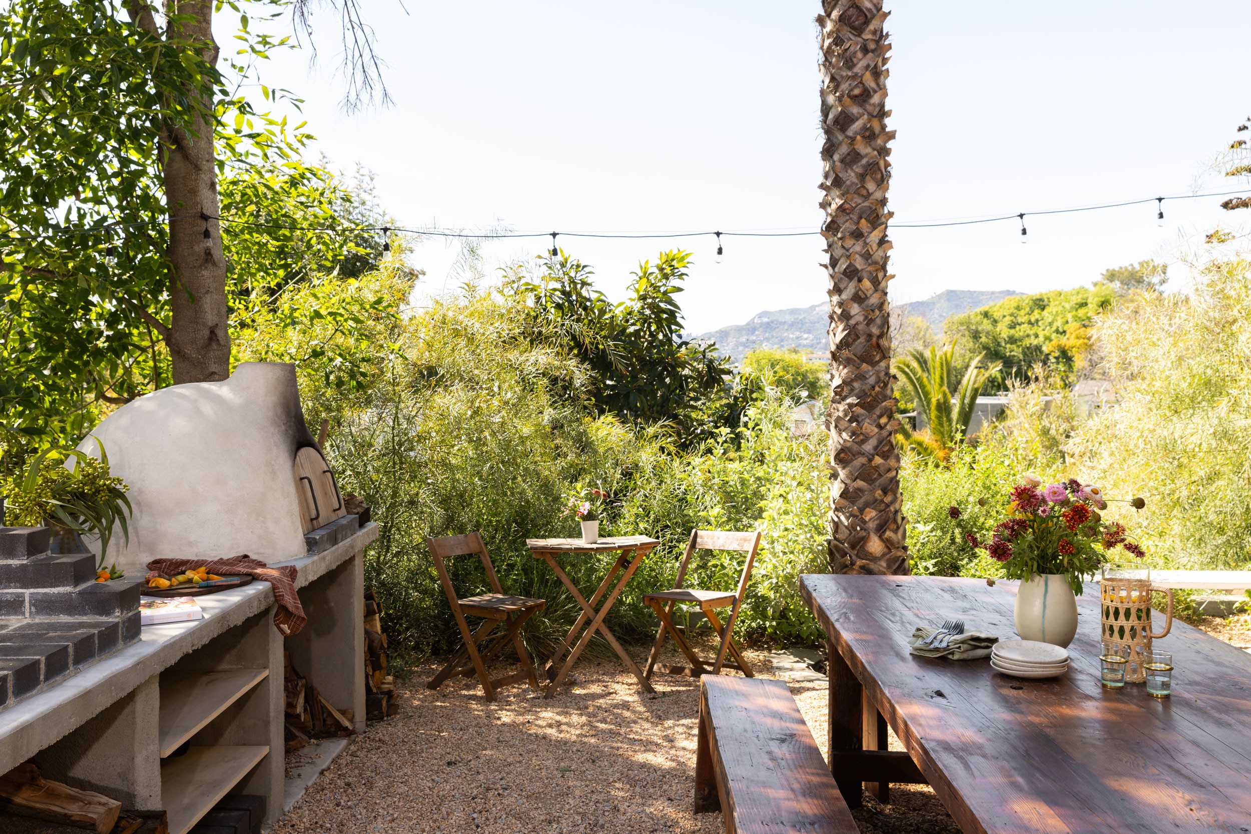 Backyard with custom wood oven in home of Sara Kramer, Kismet cookbook author in Los Angeles