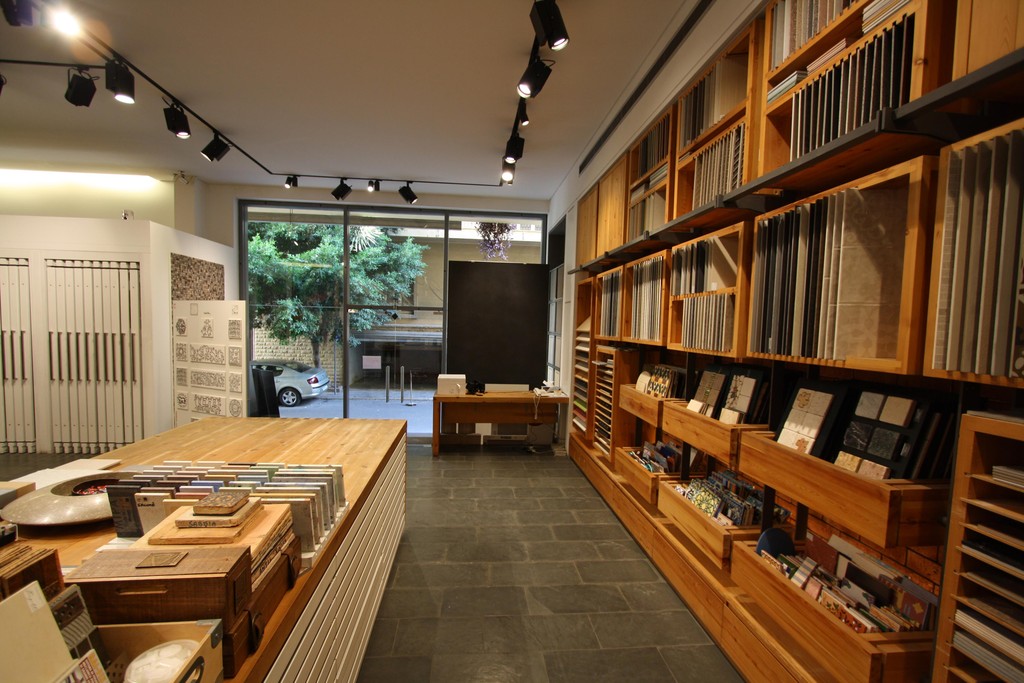 Long sample table and shelving in the showroom
