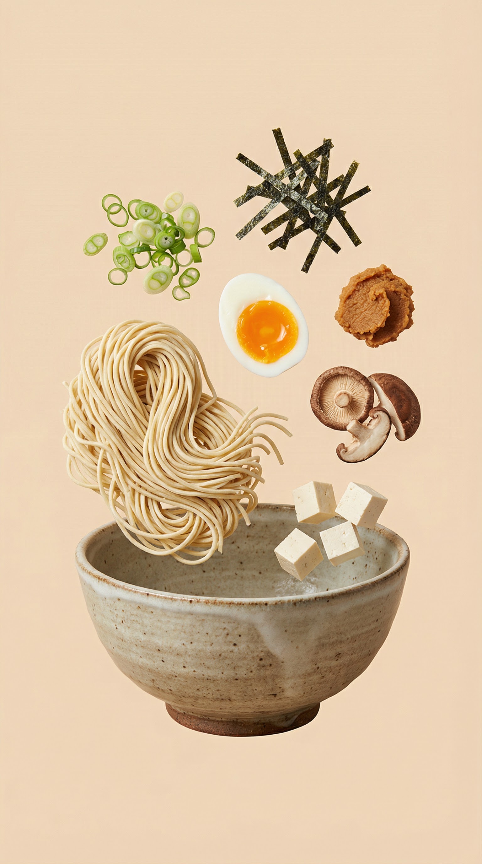 Ramen ingredients floating above a bowl with noodles, egg, miso, mushrooms, tofu, and seaweed.